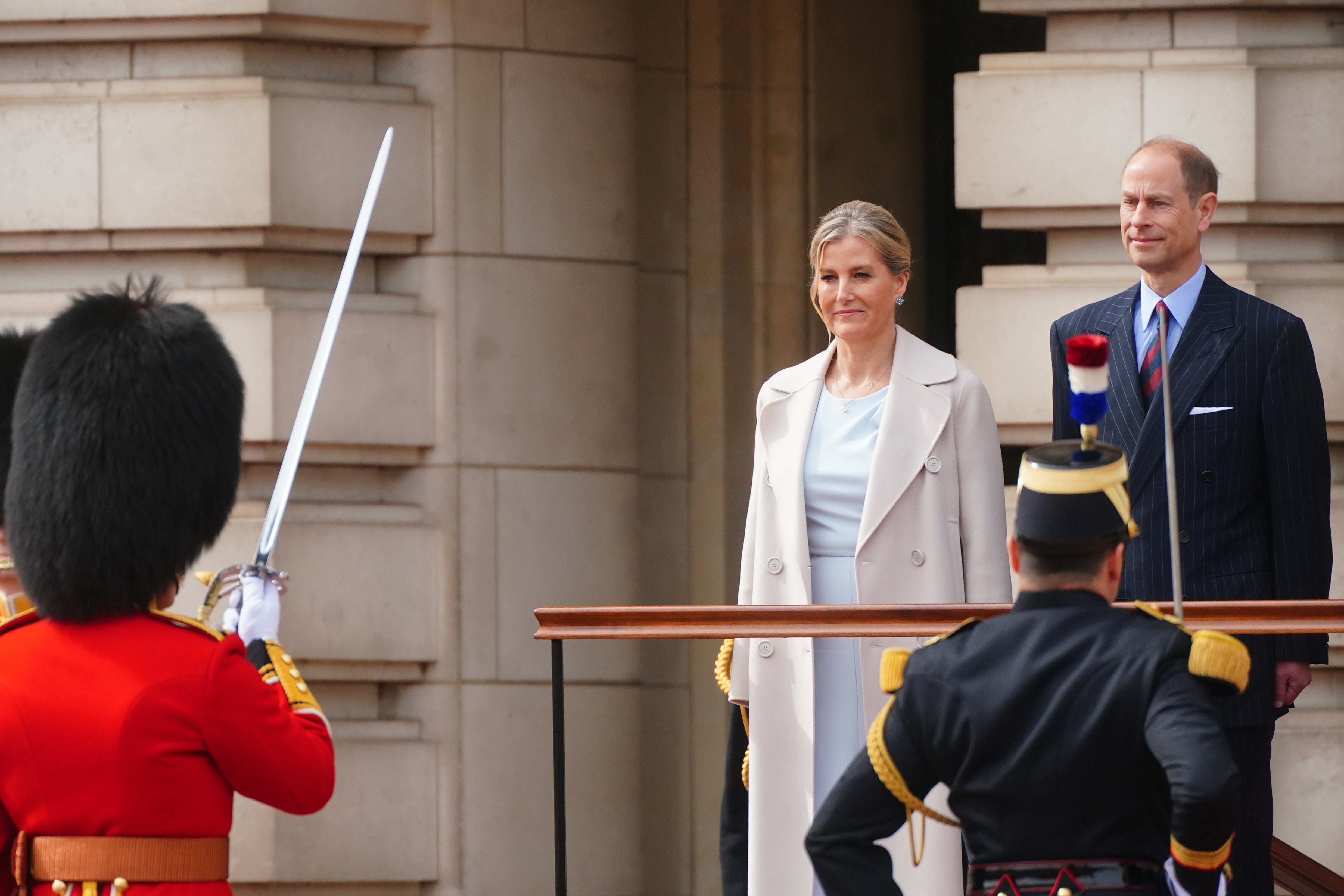 The Duke and Duchess of Edinburgh, on behalf of King Charles III, watch the Changing of the Guard at Buckingham Palace