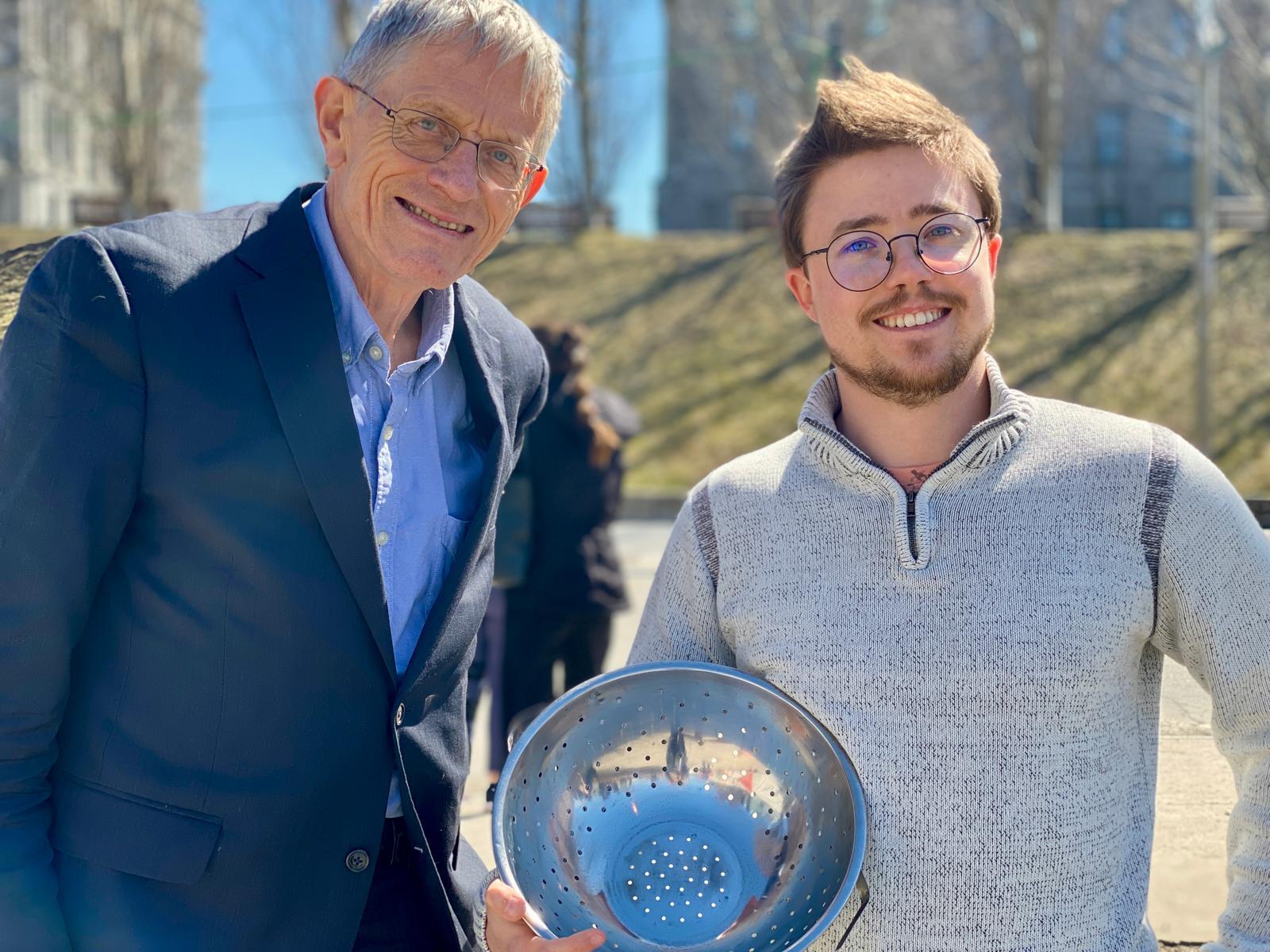 Student Sam (right) with colander and Simon Calder