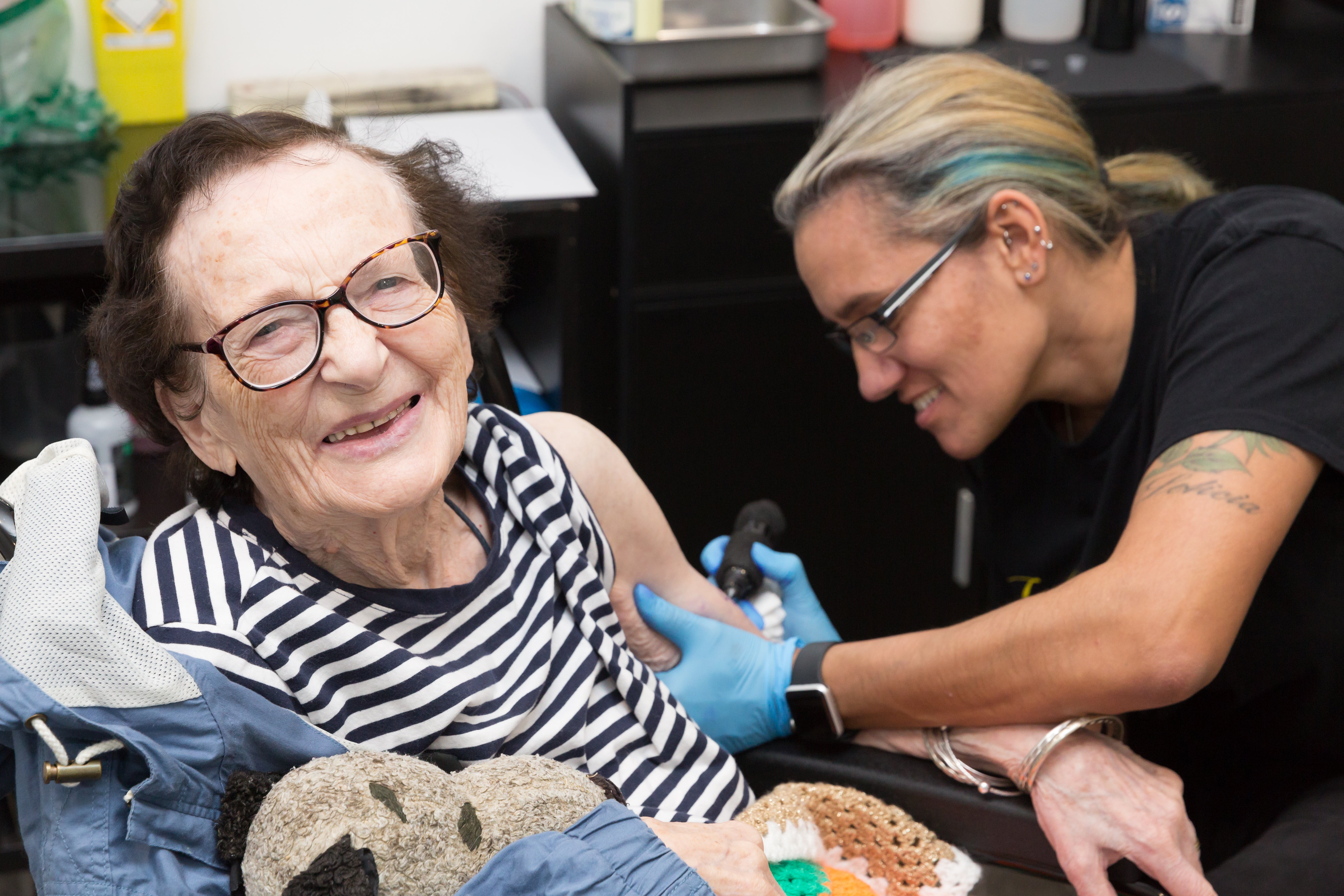 The Snoopy design was tattooed on to her left arm by artist Jodie Carville