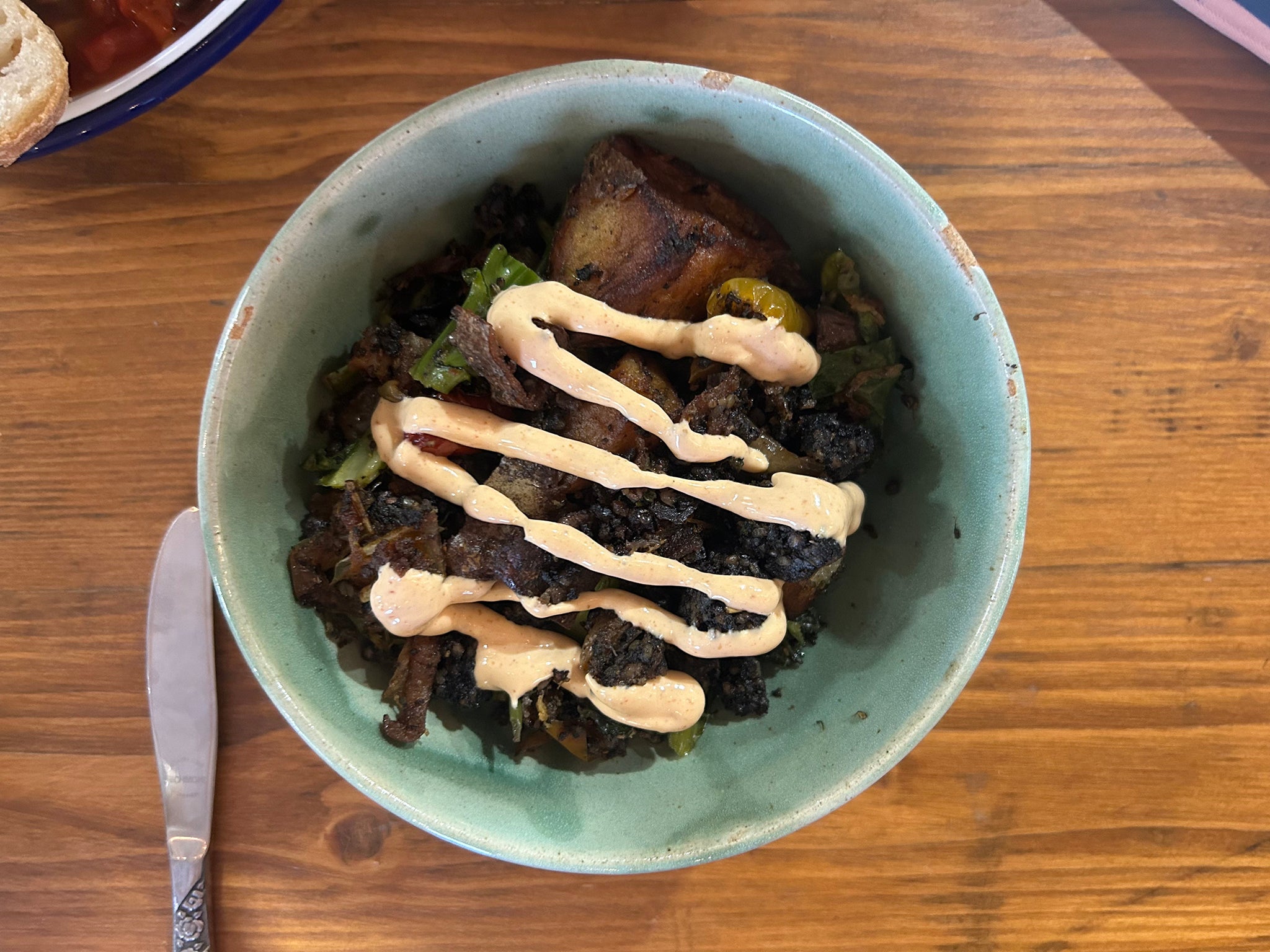 Black pudding hash with buttered greens and chipotle mayo is one of the dishes available on the ever-changing menu