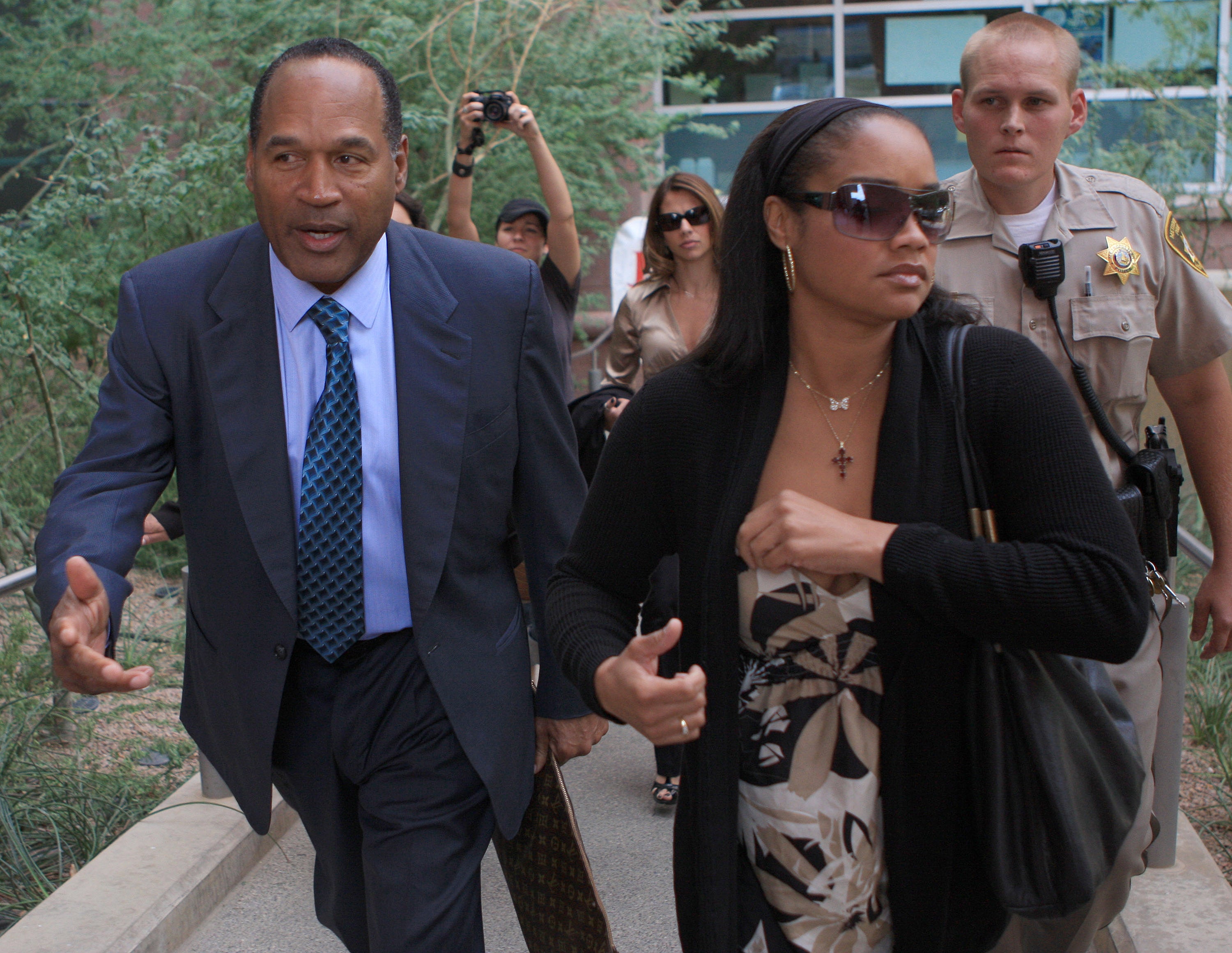 Simpson with his daughter Arnelle at the closing arguments in his trial at the Clark County Regional Justice Center on October 2, 2008 in Las Vegas