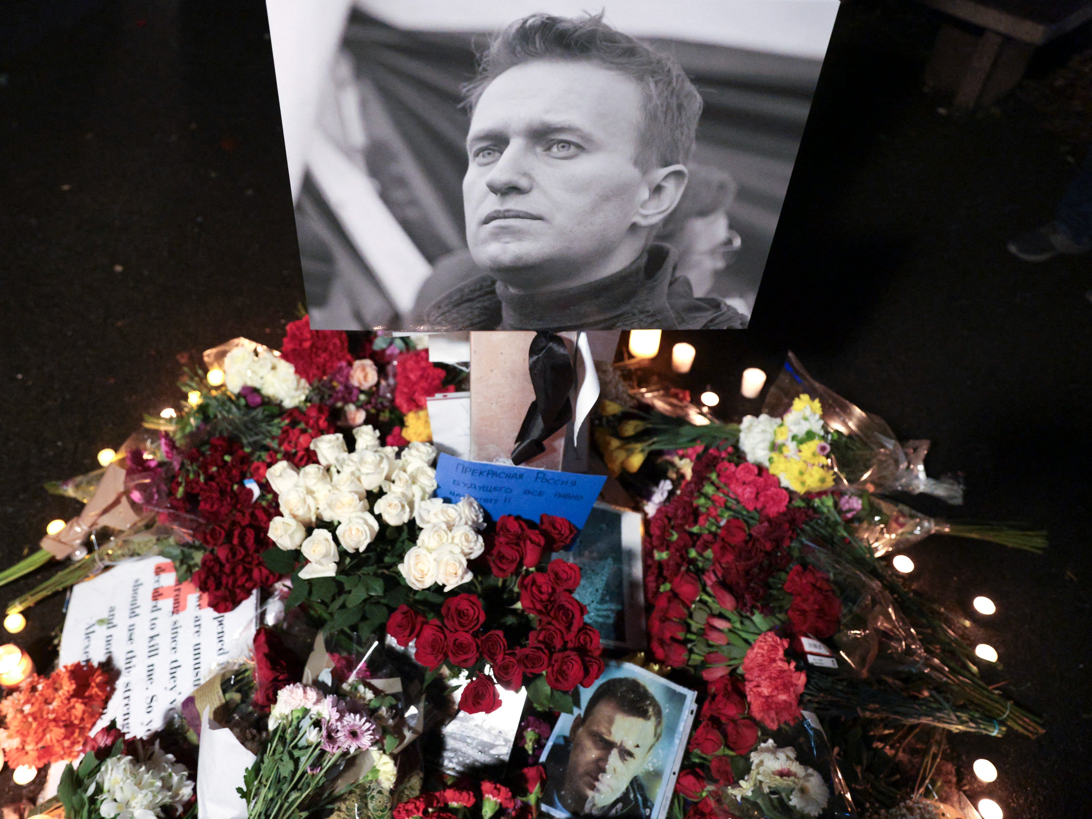 Members of the Russian Action Network for Democratic Organizing and Mentoring and the local Russian community hold a memorial for late Russian opposition leader Alexei Navalny at the "Peace Pole" next to the Space Needle in Seattle, Washington on 1 March 2024