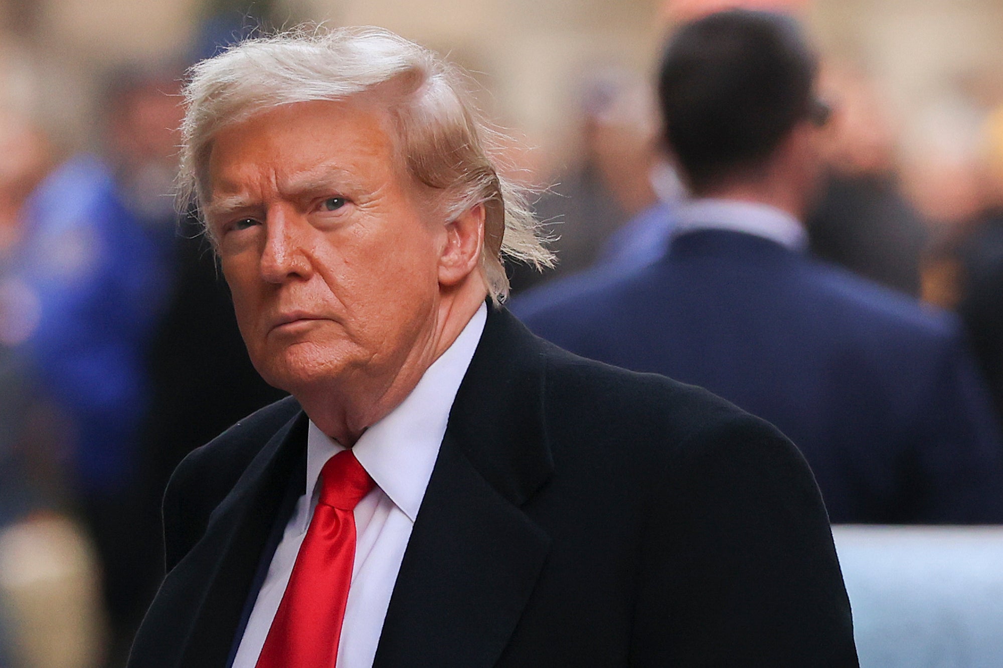 Donald Trump arrives for a press conference at 40 Wall Street after a pre-trial hearing at Manhattan criminal court on 25 March.