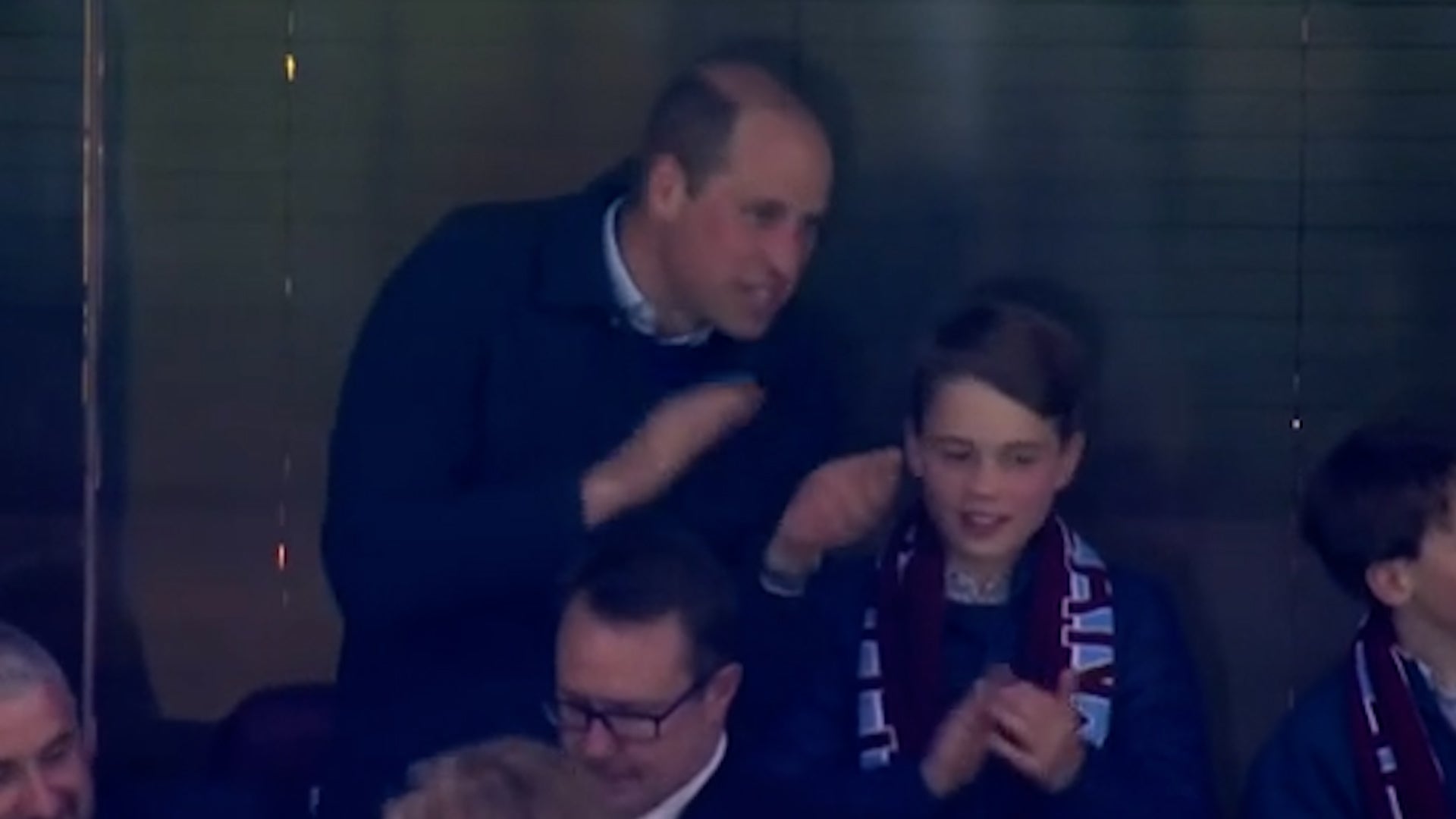 Prince William was seen smiling and applauding in the Villa Park stands in Birmingham with his eldest son on Thursday evening