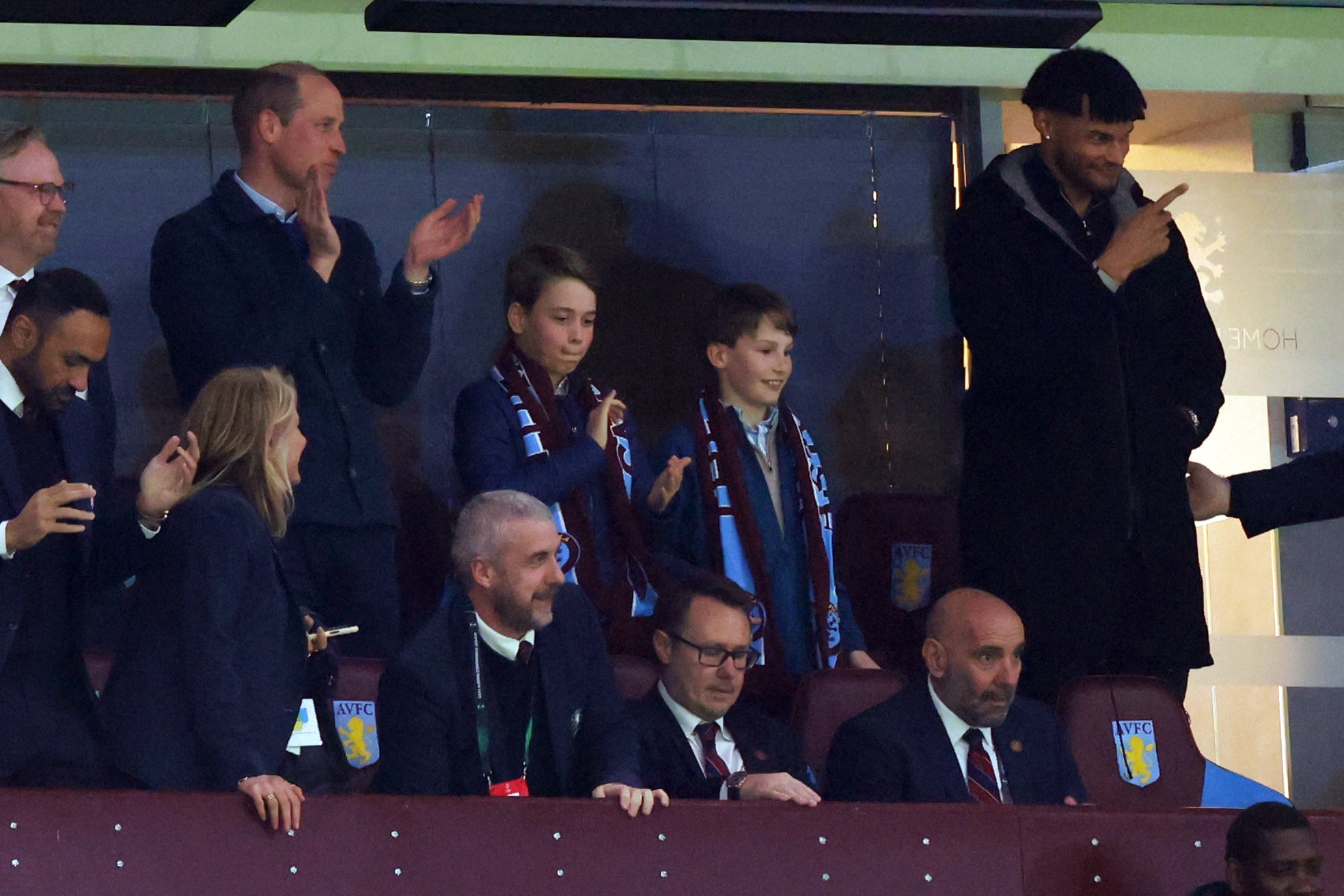 Prince William and George clap at an Aston Villa match on Thursday