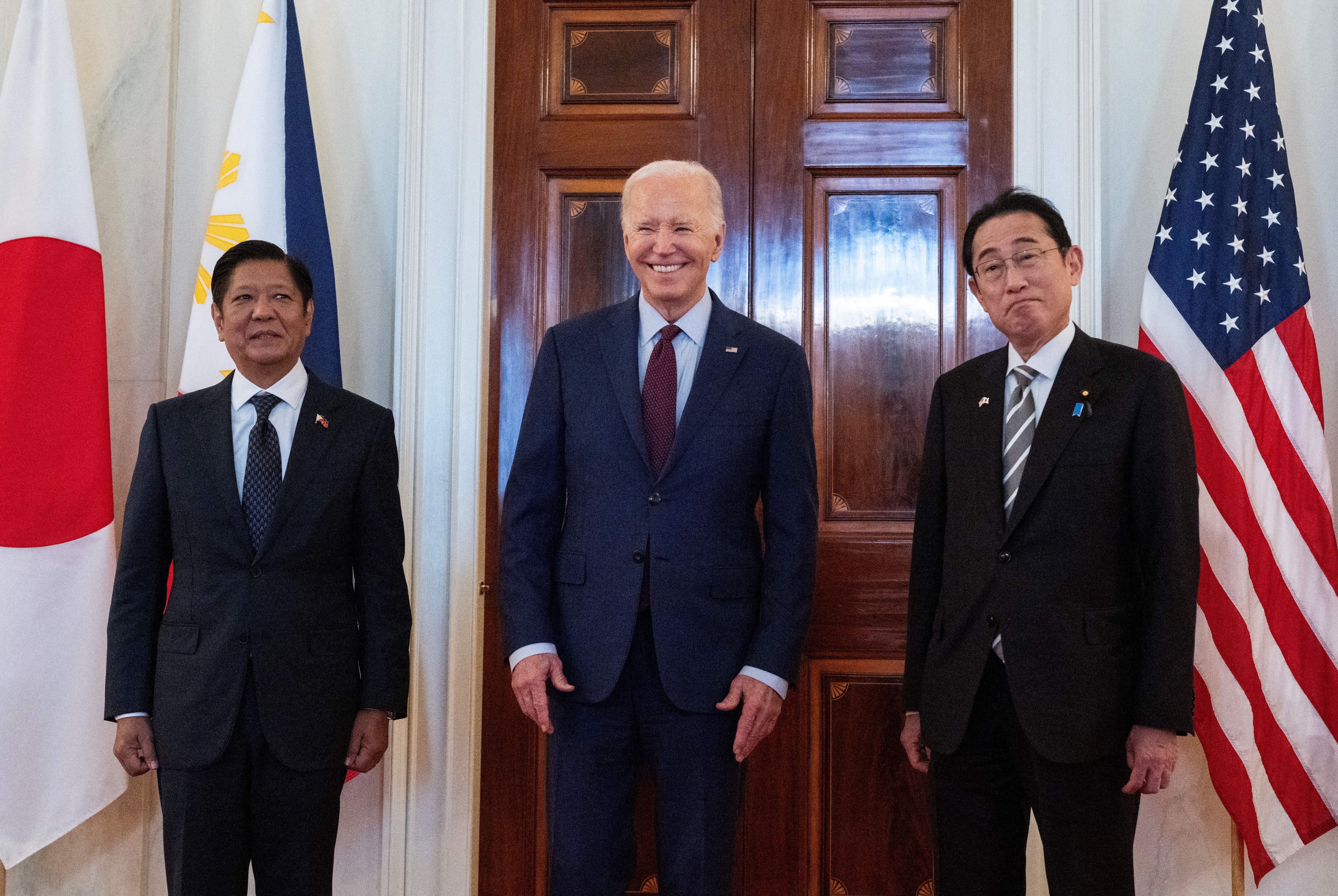 US President Joe Biden speaks to the press with Japanese prime minister Fumio Kishida (R) and Filipino president Ferdinand Marcos Jr. (L) ahead of a trilateral meeting at the White House in Washington, DC, on 11 April 2024