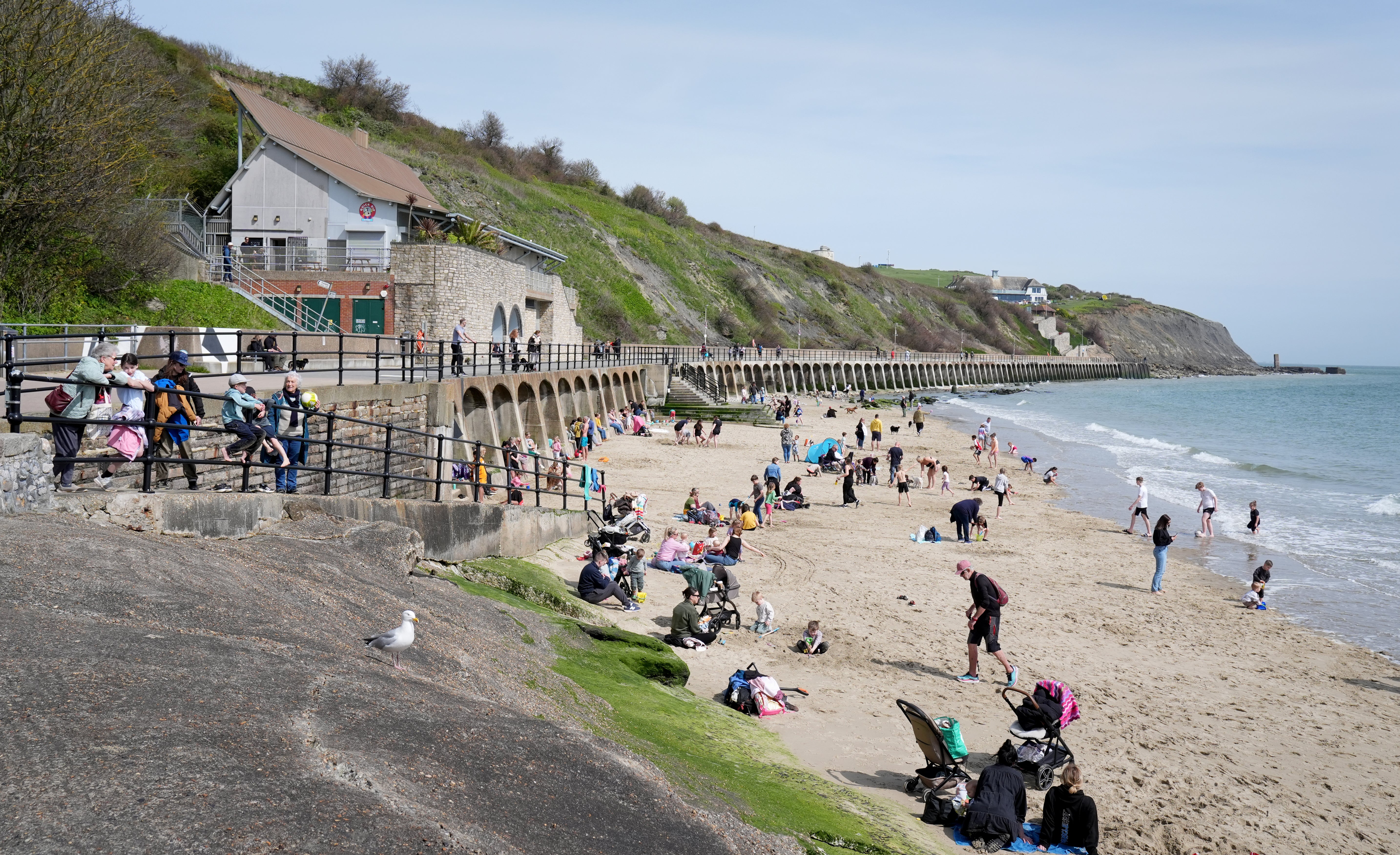 People enjoy the beach during fine weather on Friday 12th April in Folkestone, Kent.