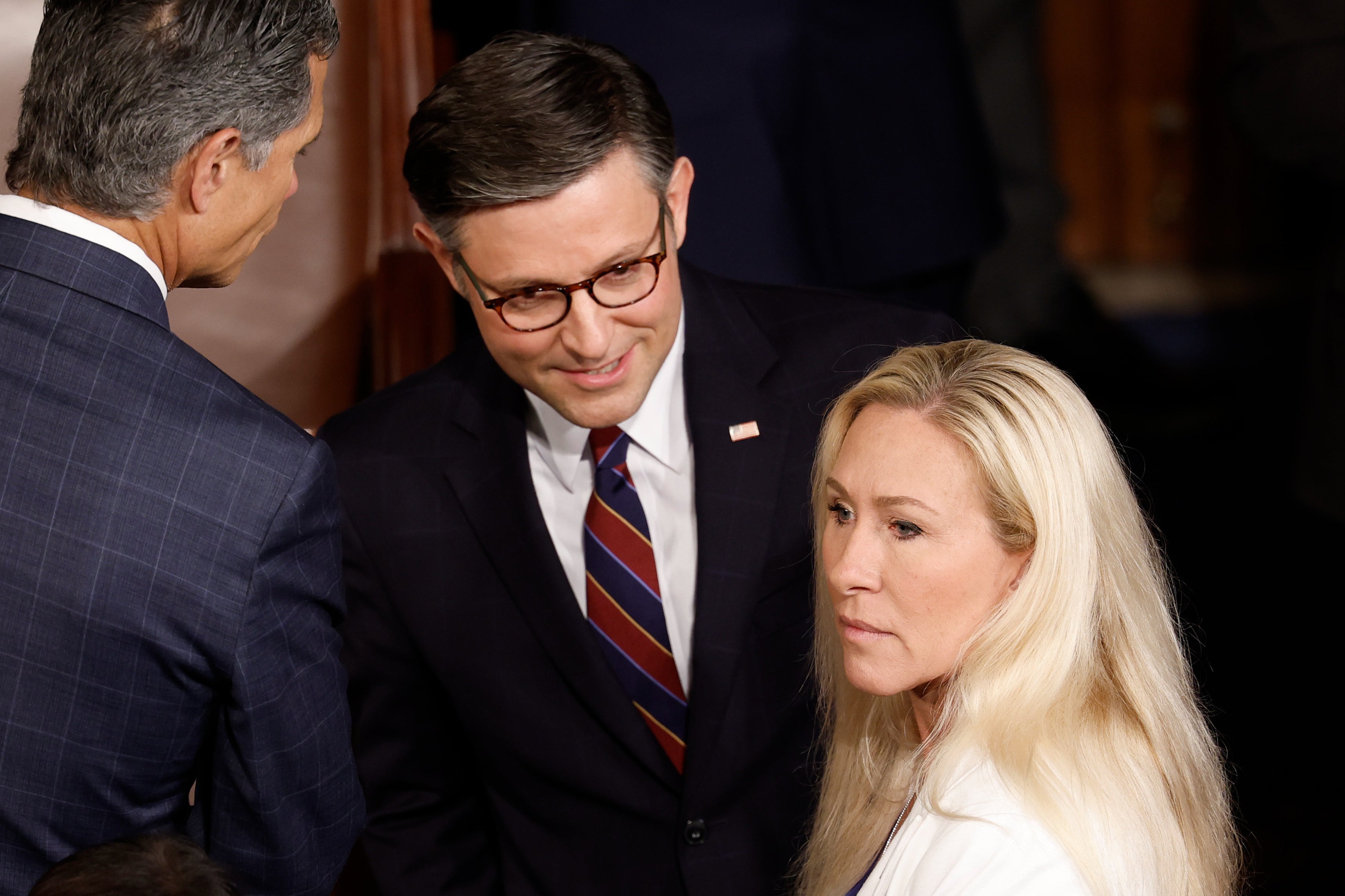 Speaker of the House Mike Johnson (left) and Representative Marjorie Taylor Greene (right) pictured speak to one another in the US Capitol in April. Ms Greene vowed to force a vote on Mr Johnson’s removal this week