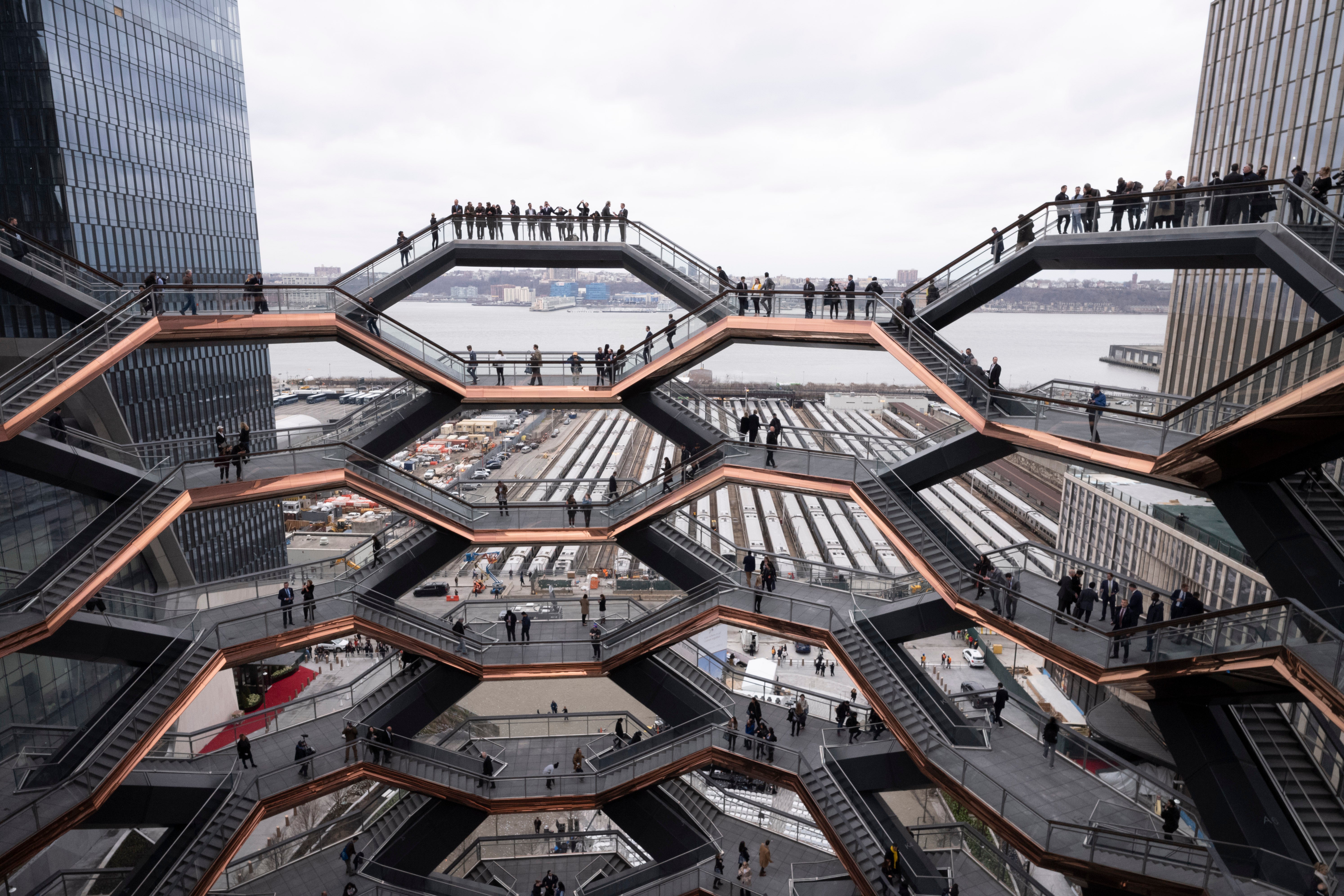 Visitors to the Vessel climb its staircases on its opening day at Hudson Yards in New York in MArch 2019.