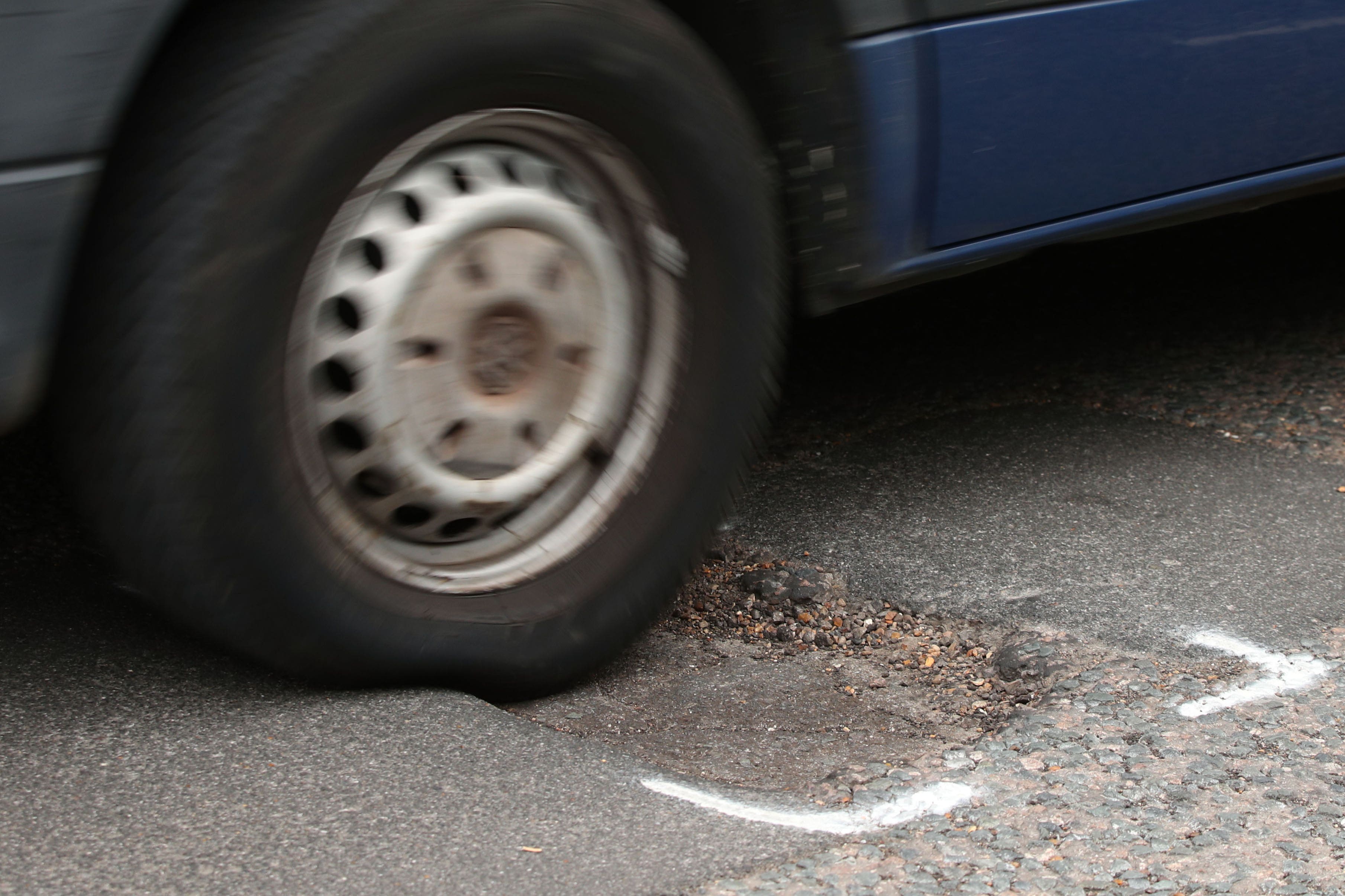 Britain’s roads now have 100 times as many potholes as there are craters on the Moon, the Labour Party has claimed (PA)