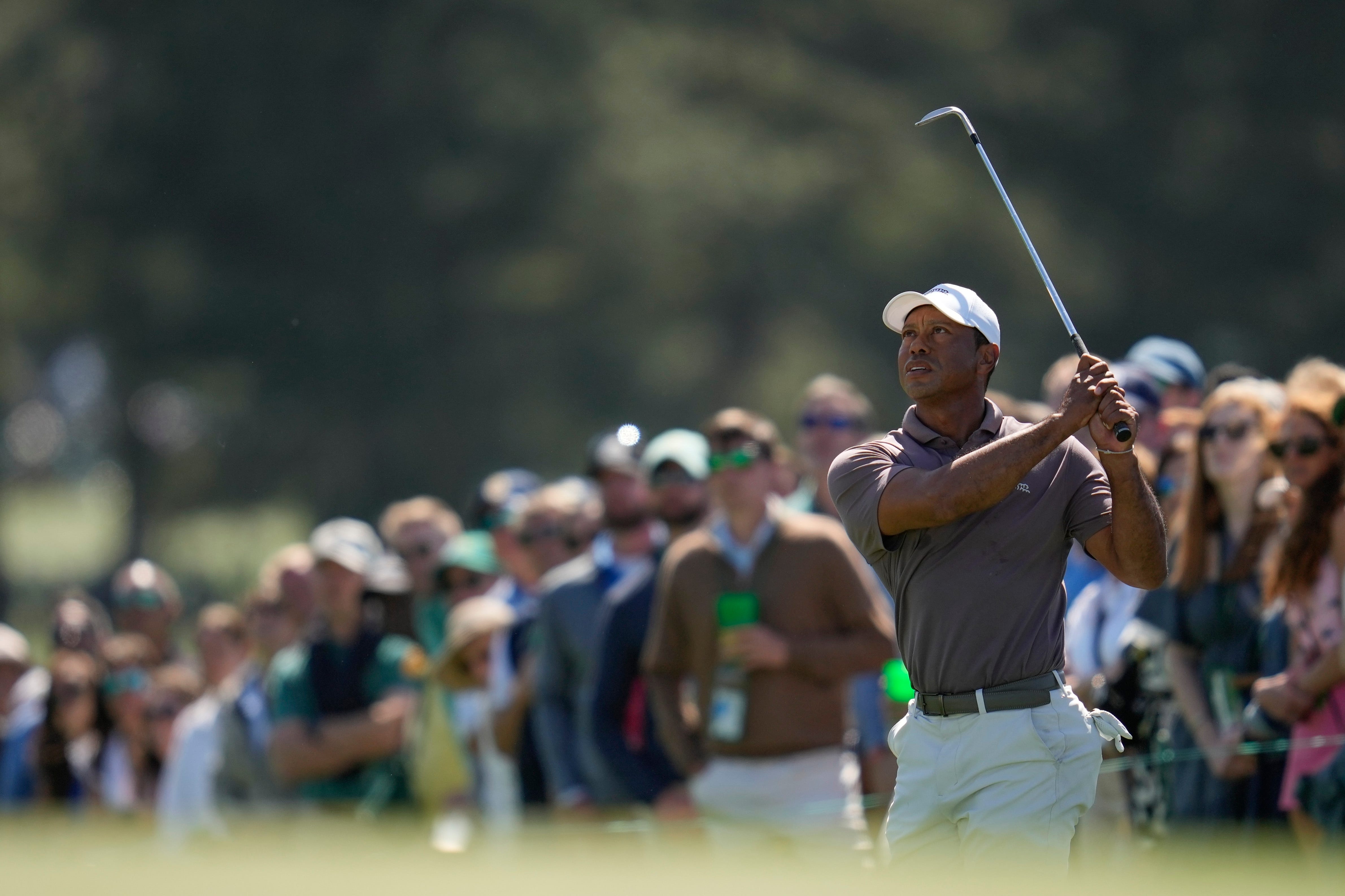 Tiger Woods watches his chip on the 18th hole during the second round of the Masters (Ashley Landis/AP)