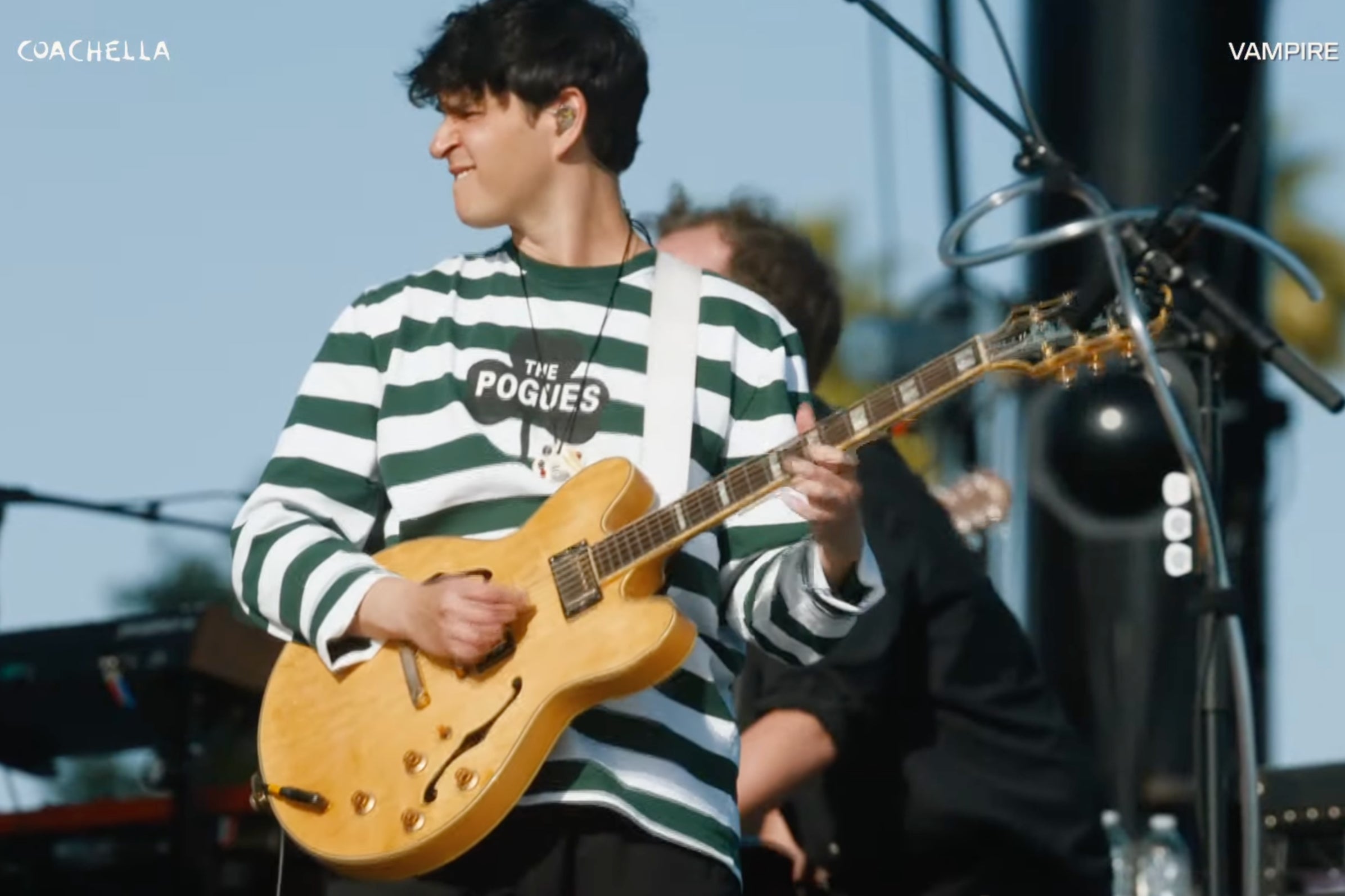 Vampire Weekend frontman Ezra Koenig wearing a ‘The Pogues’ shirt onstage at Coachella 2024