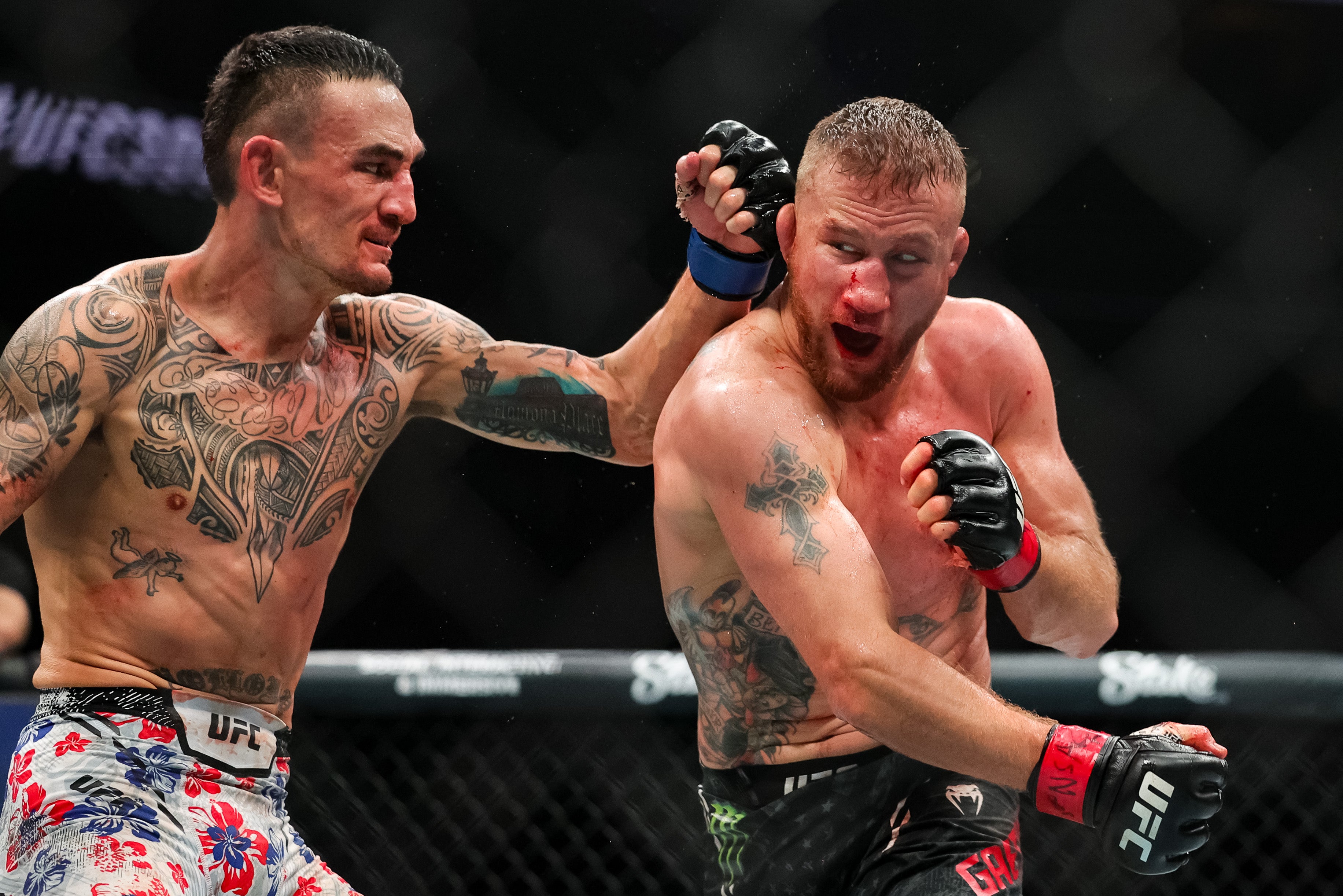 Max Holloway (left) scored an all-time great KO of Justin Gaethje in April