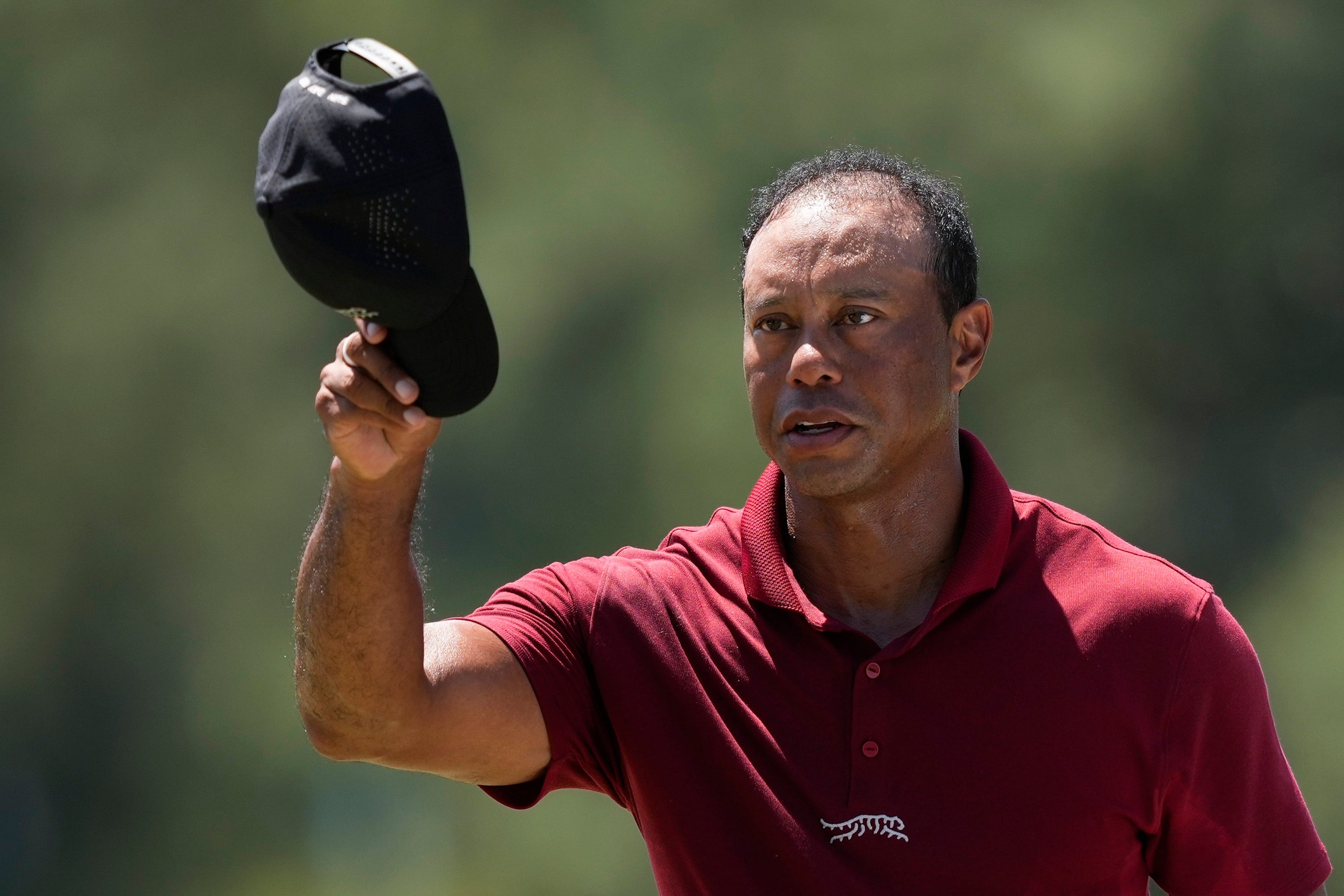 Tiger Woods waves to spectators after his final round in the 88th Masters (David J Phillip/AP)