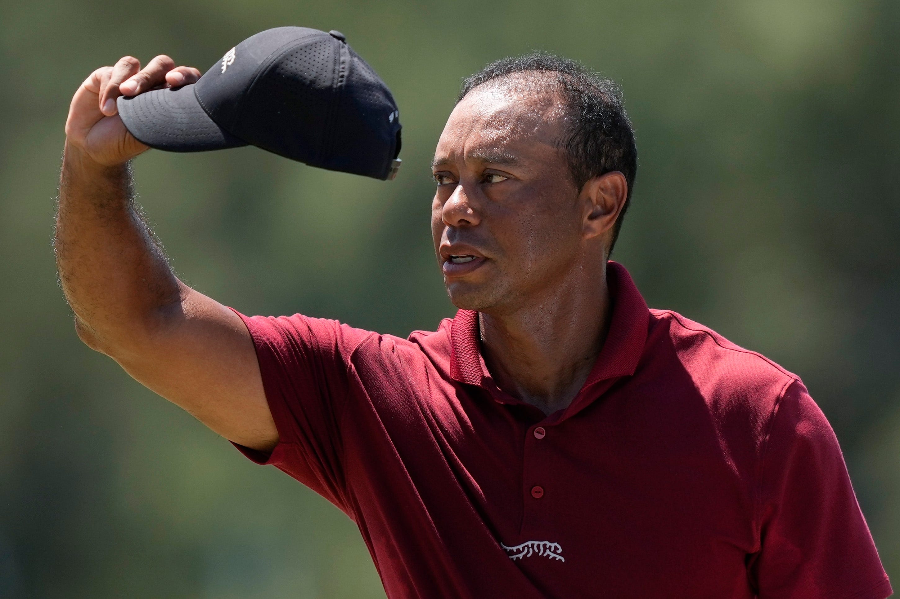 Tiger Woods waves after his final round in the 88th Masters (David J. Phillip/AP)