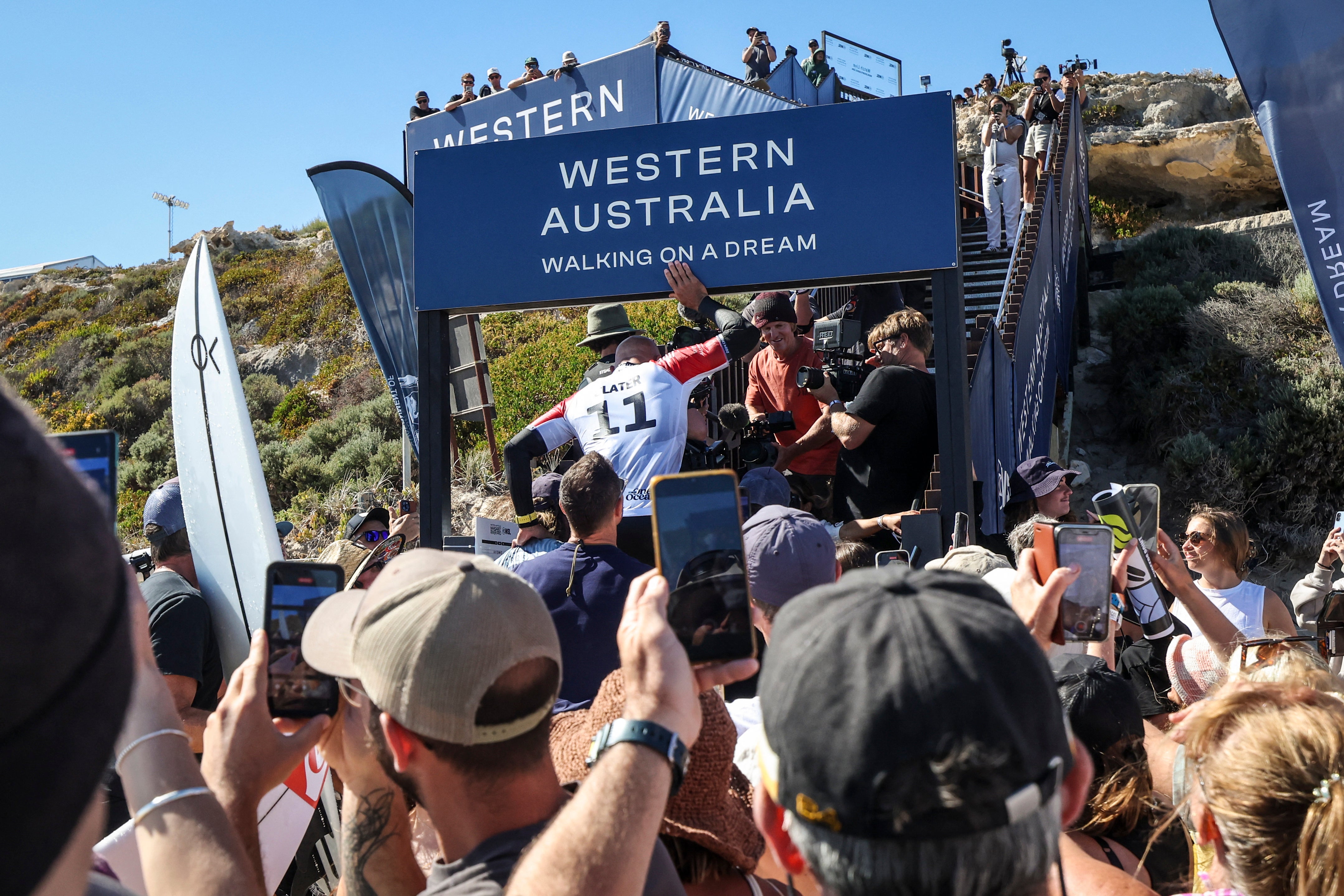 Slater was carried up the beach by fans after his final competition