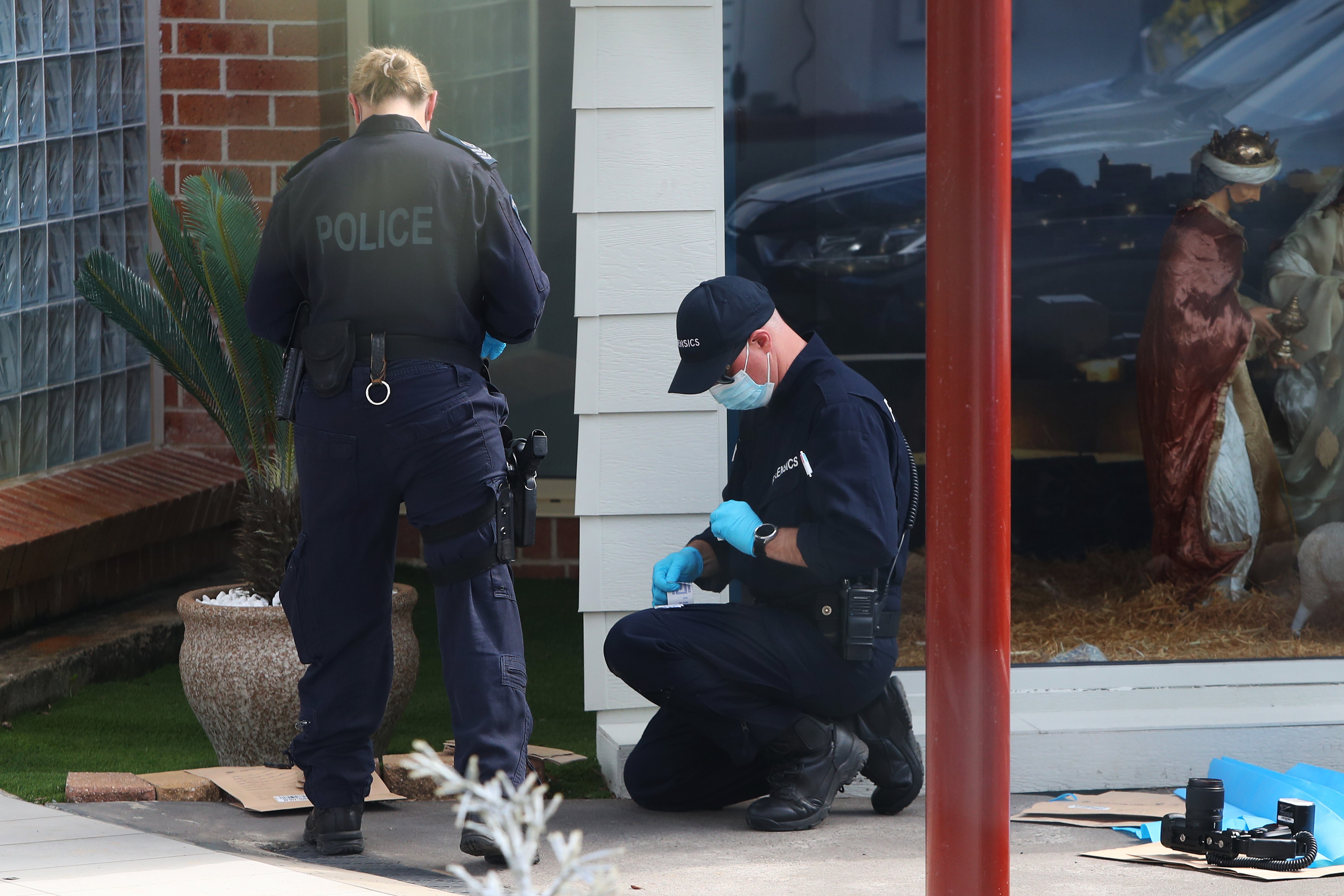 Forensic officers at the church in the Sydney suburb earlier this week