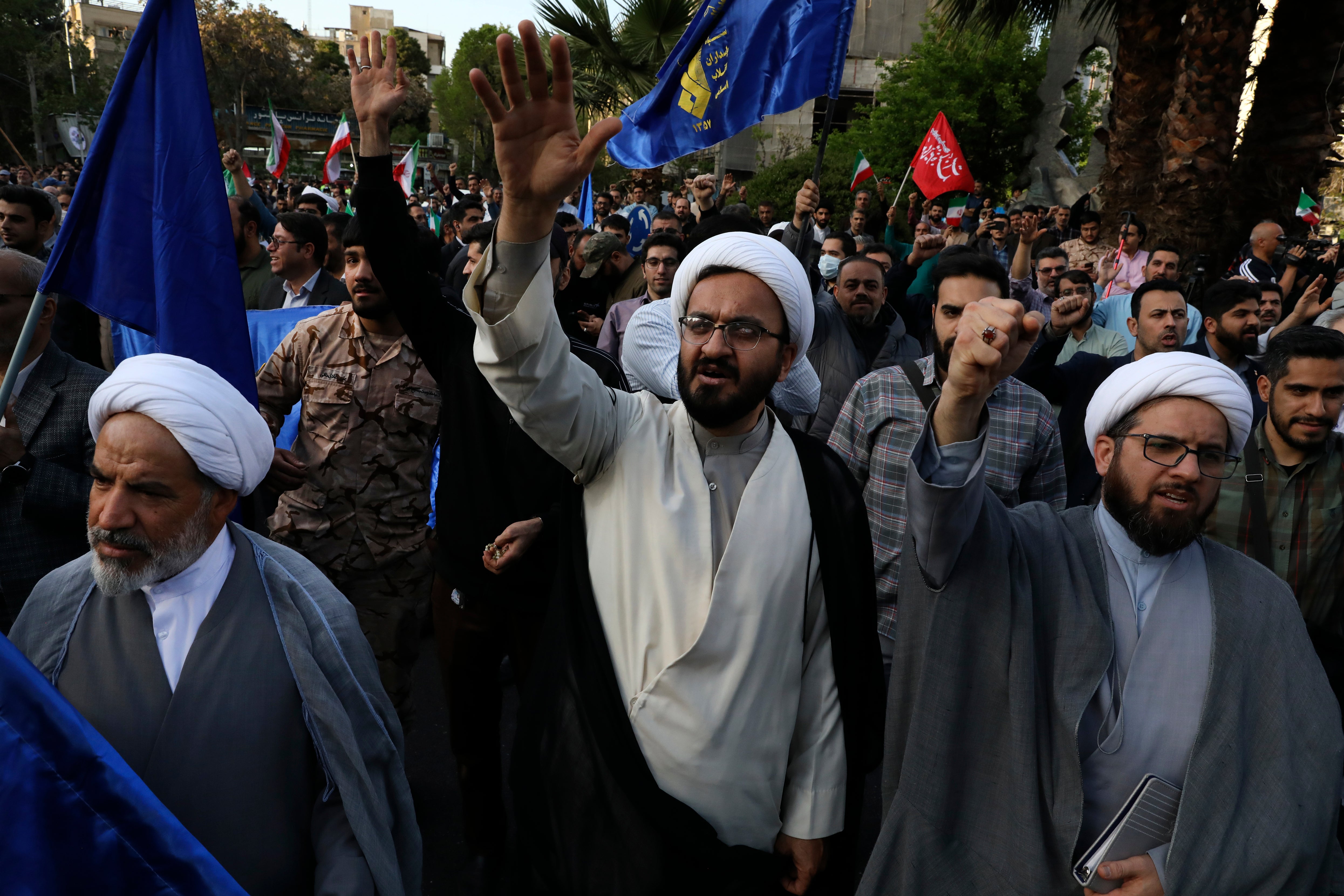 Iranian demonstrators chant slogans during their anti-Israeli gathering at the Felestin (Palestine) Sq. in Tehran