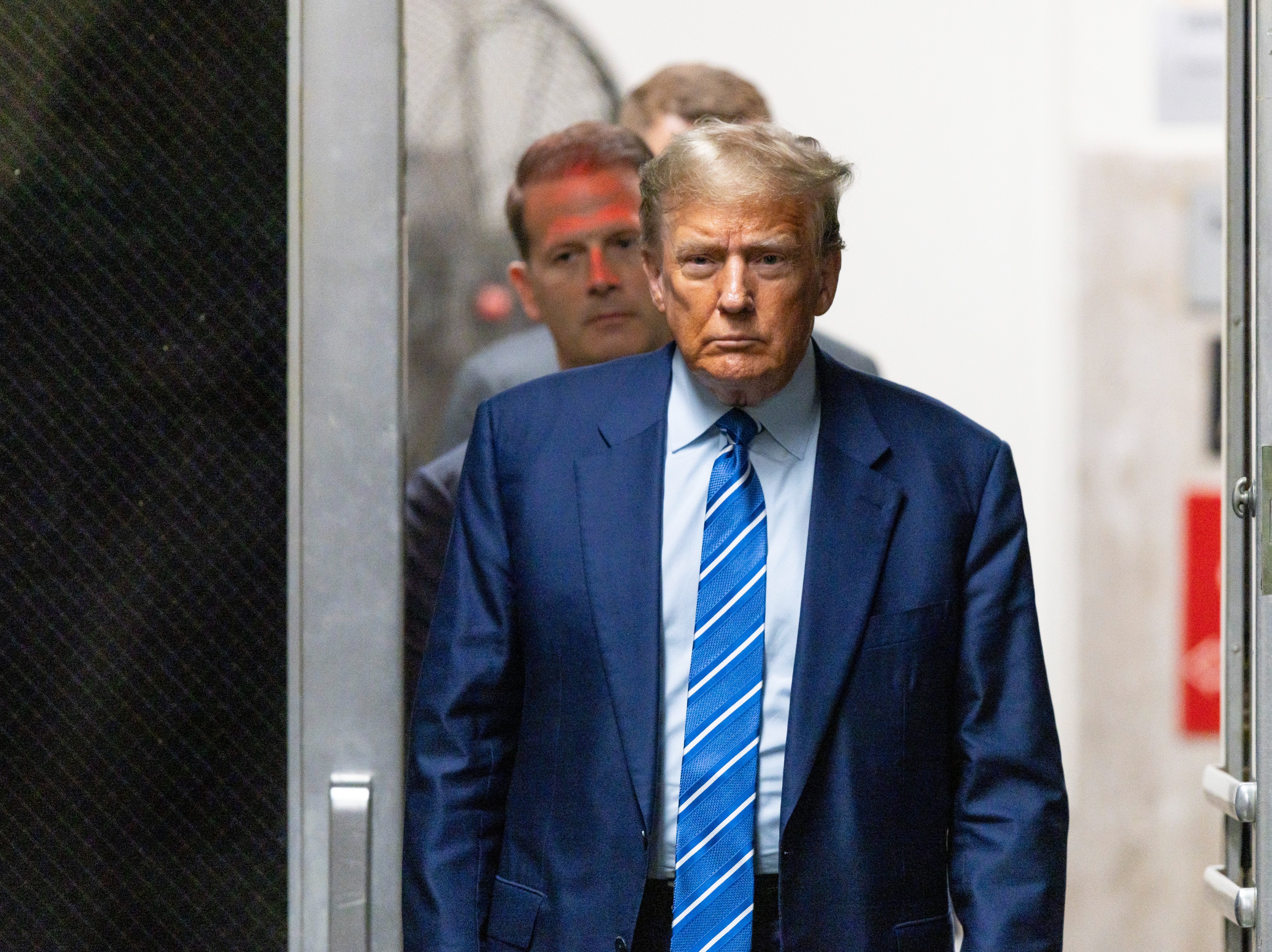 Former President Donald Trump returns to the courtroom after a recess during the second day of jury selection at Manhattan criminal court