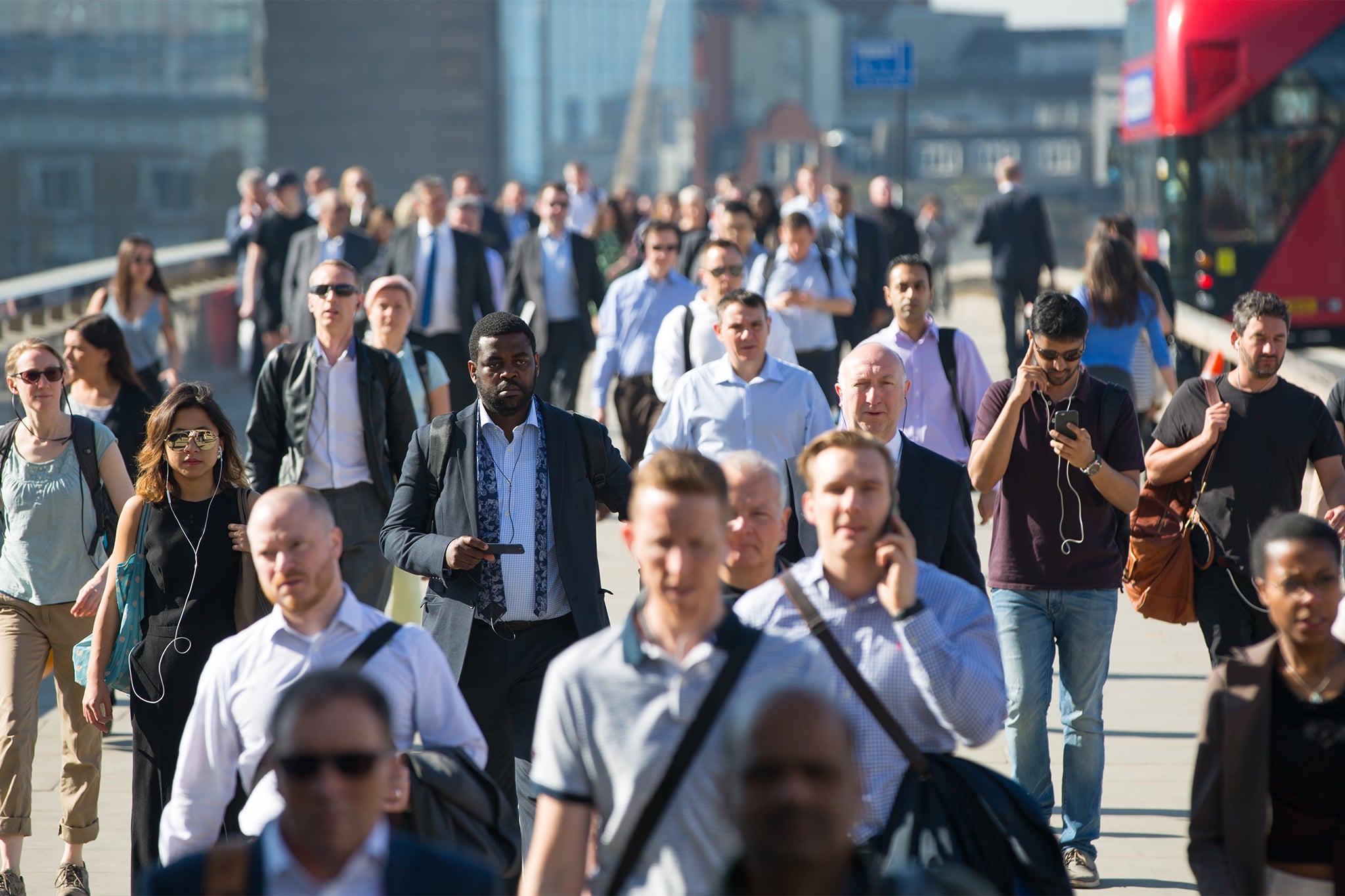 Office workers crossing London bridge on the way to the City