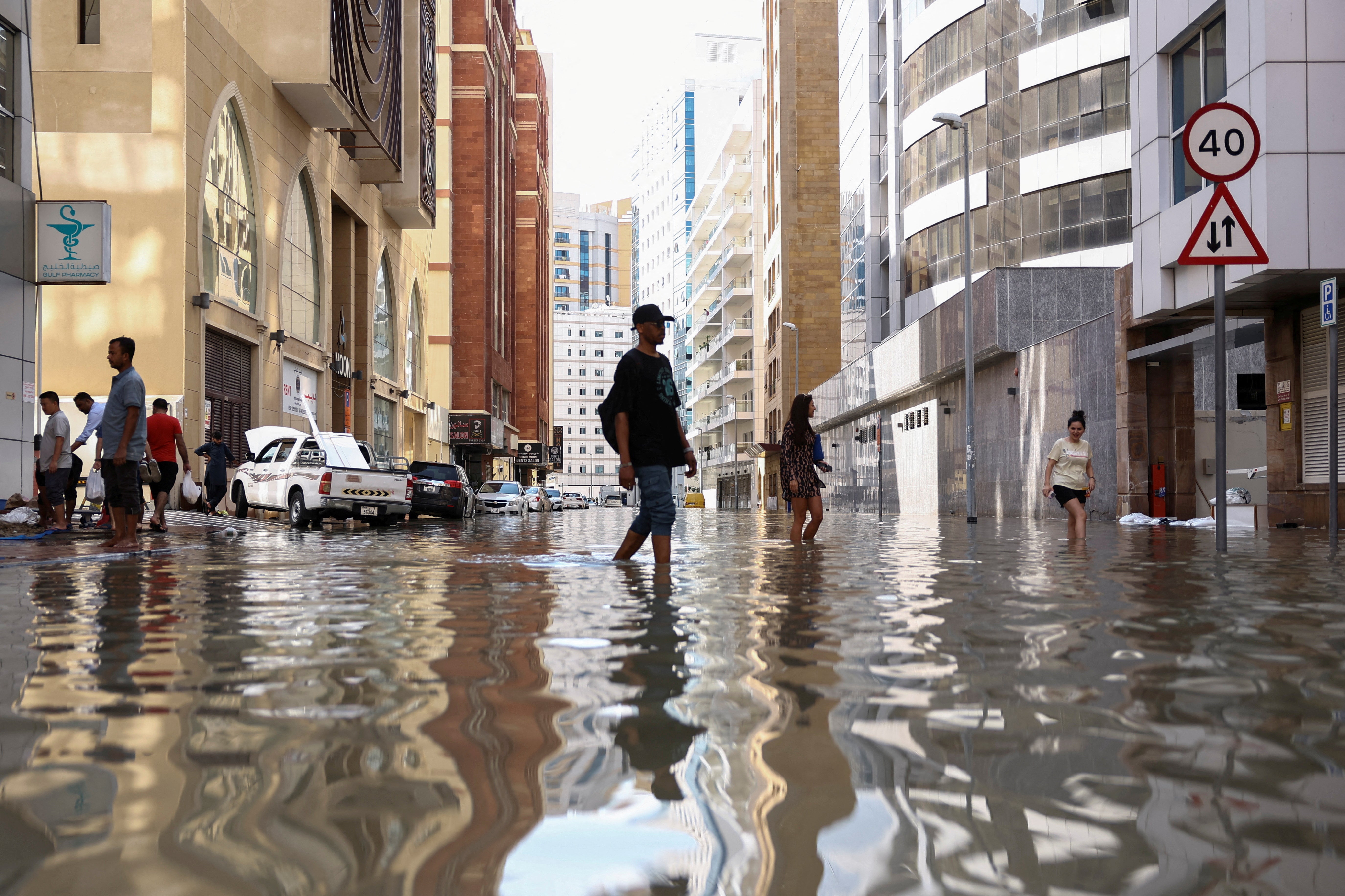 A man walks through the devastating Dubai floods