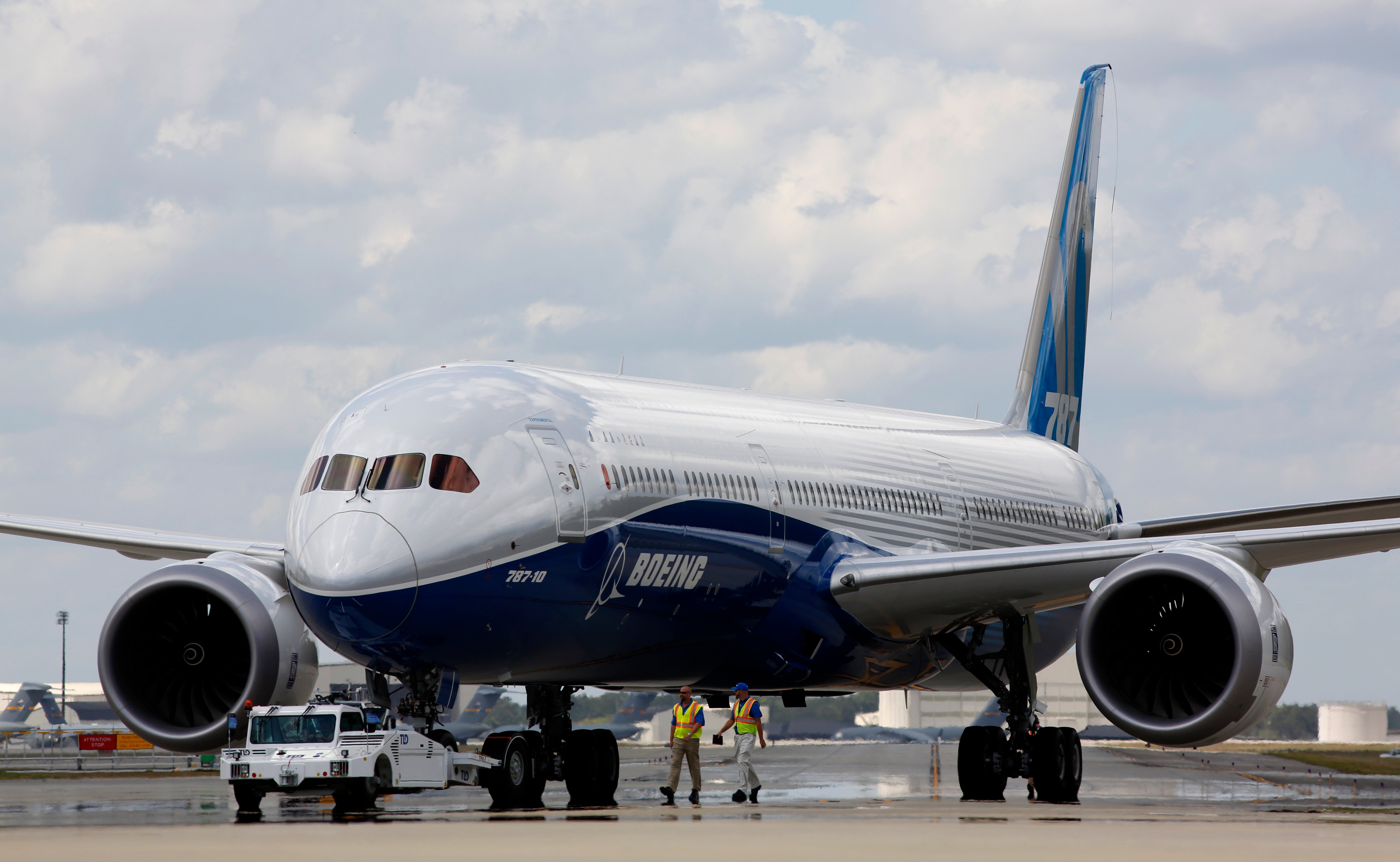 Boeing employees walk the new Boeing 787-10 Dreamliner down towards the delivery ramp area at the company’s facility after conducting its first test flight at Charleston International Airport, March 31, 2017