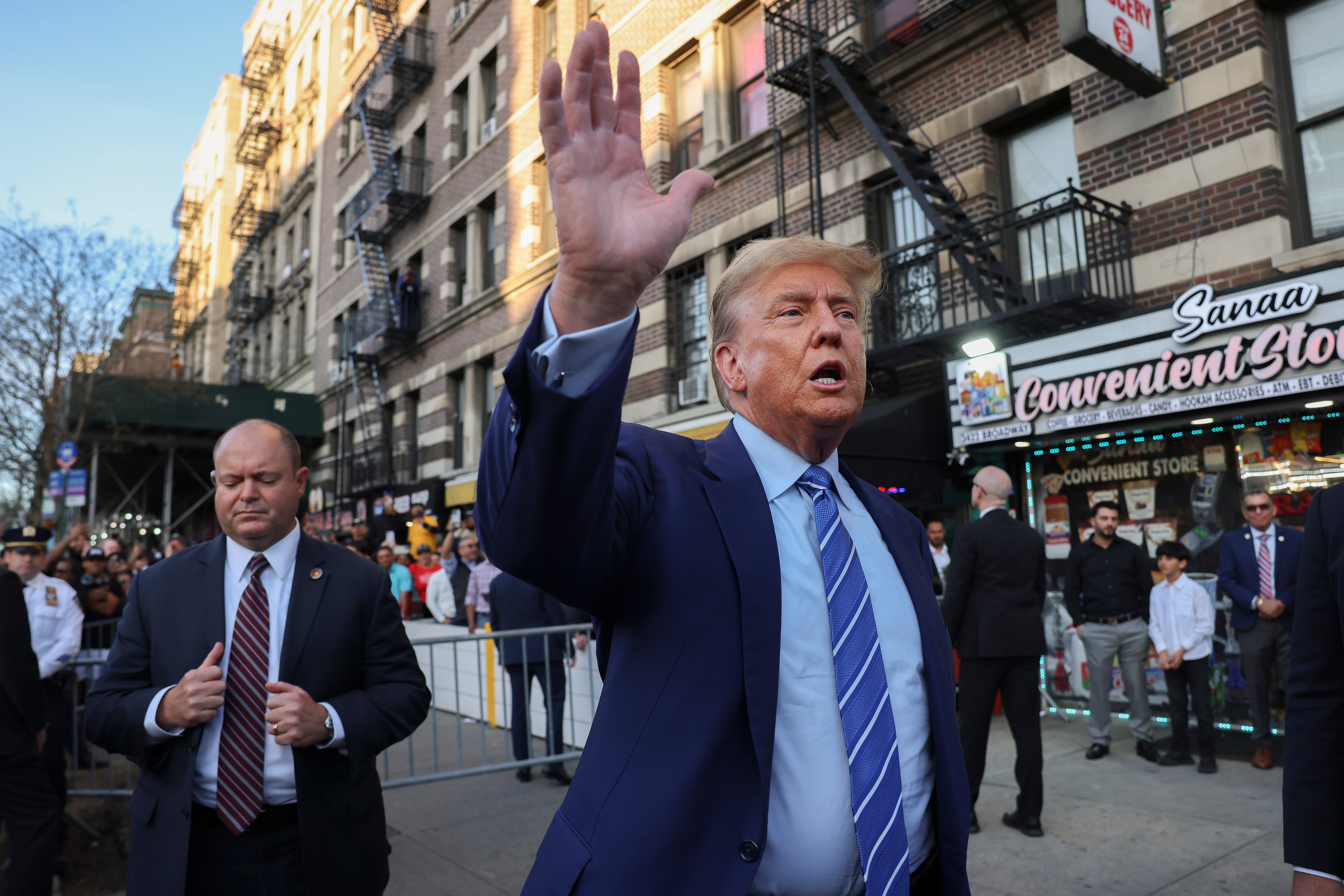 Former president Donald Trump, talks to members of the media while visiting a bodega, after leaving court for his hush money trial on Tuesday 16 April 2024