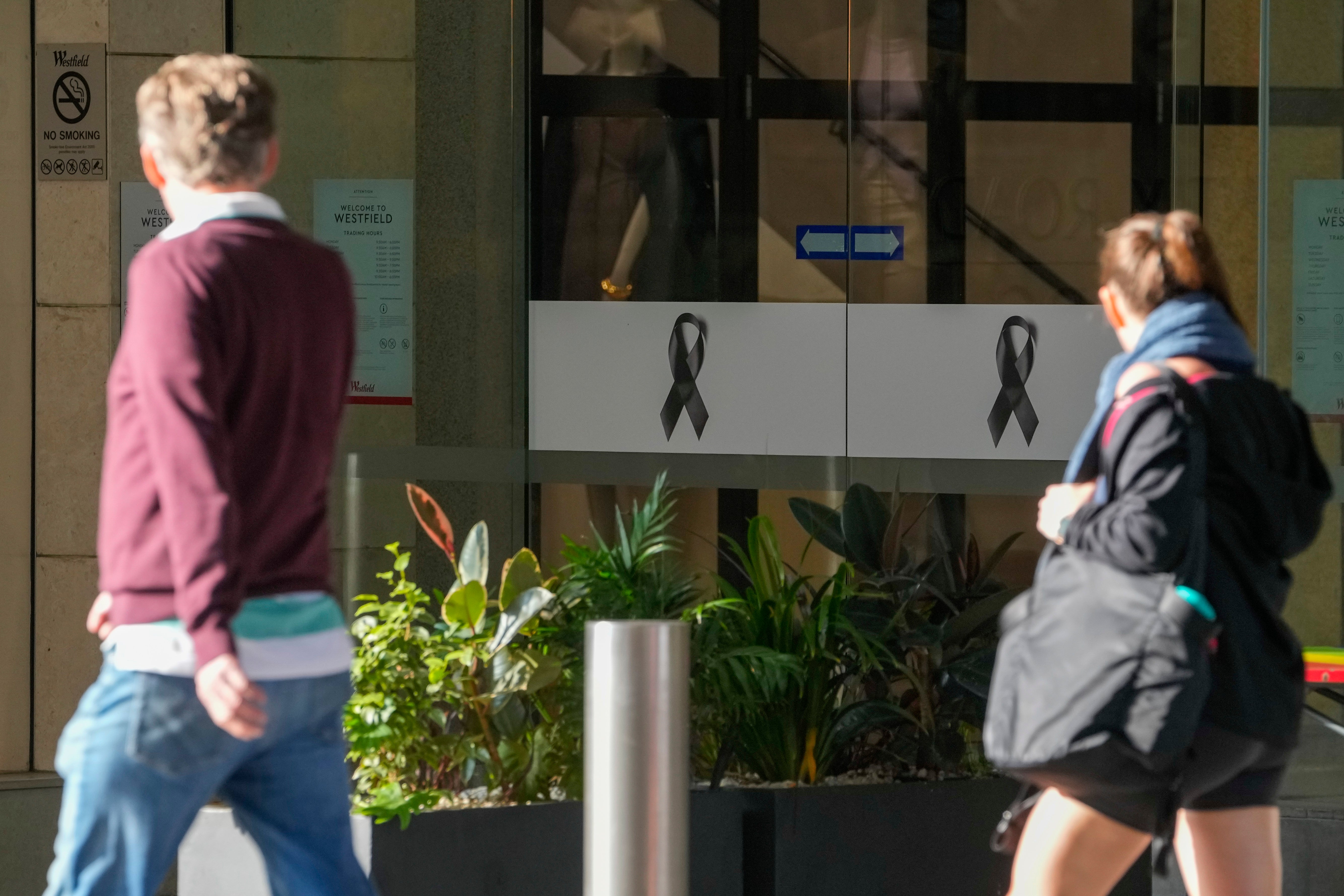 People walk past the entrance to the Westfield mall at Bondi Junction in Sydney