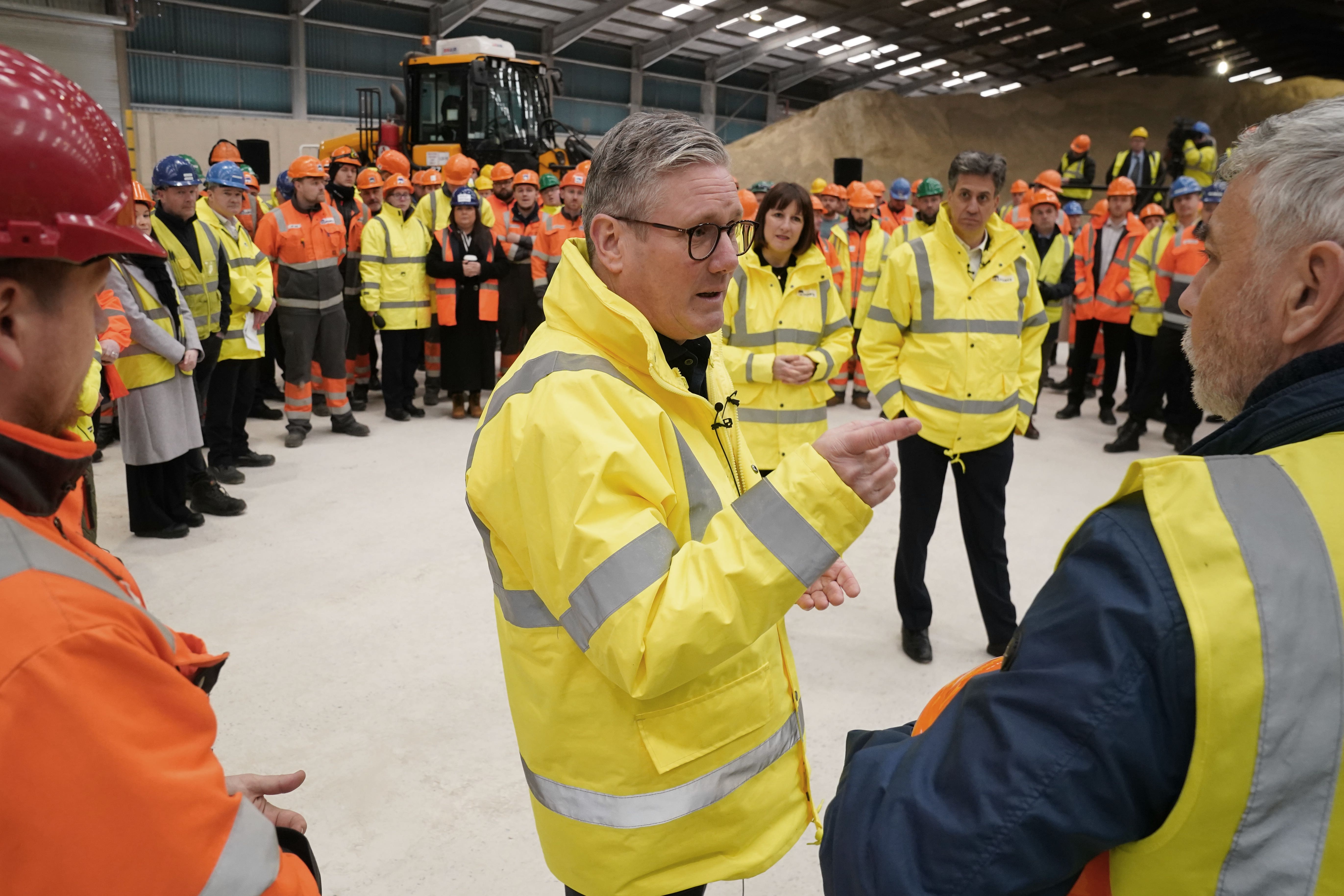 Labour Party leader Sir Keir Starmer talks to union convenor Mark Hannon (right) during a question and answer session with port workers (Owen Humphreys/PA)