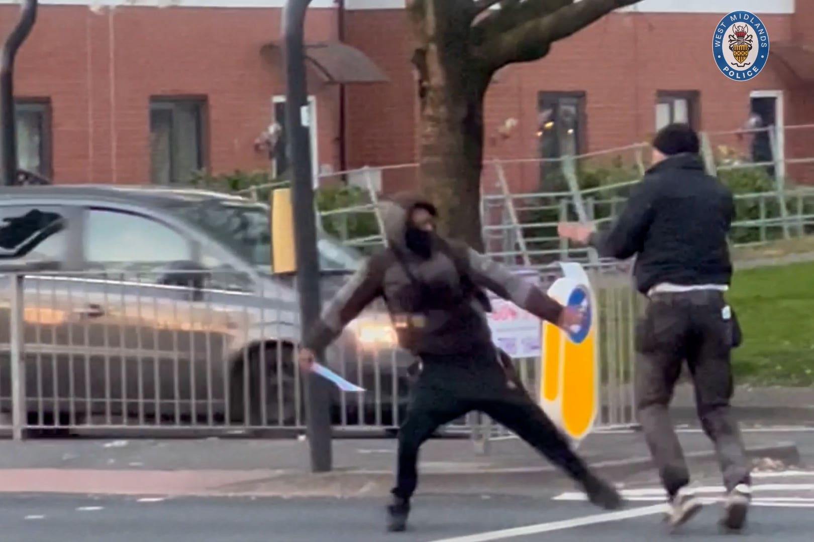 Kelvin Ward, right, trying to defend himself before being stabbed to death in the street (West Midlands Police/PA)