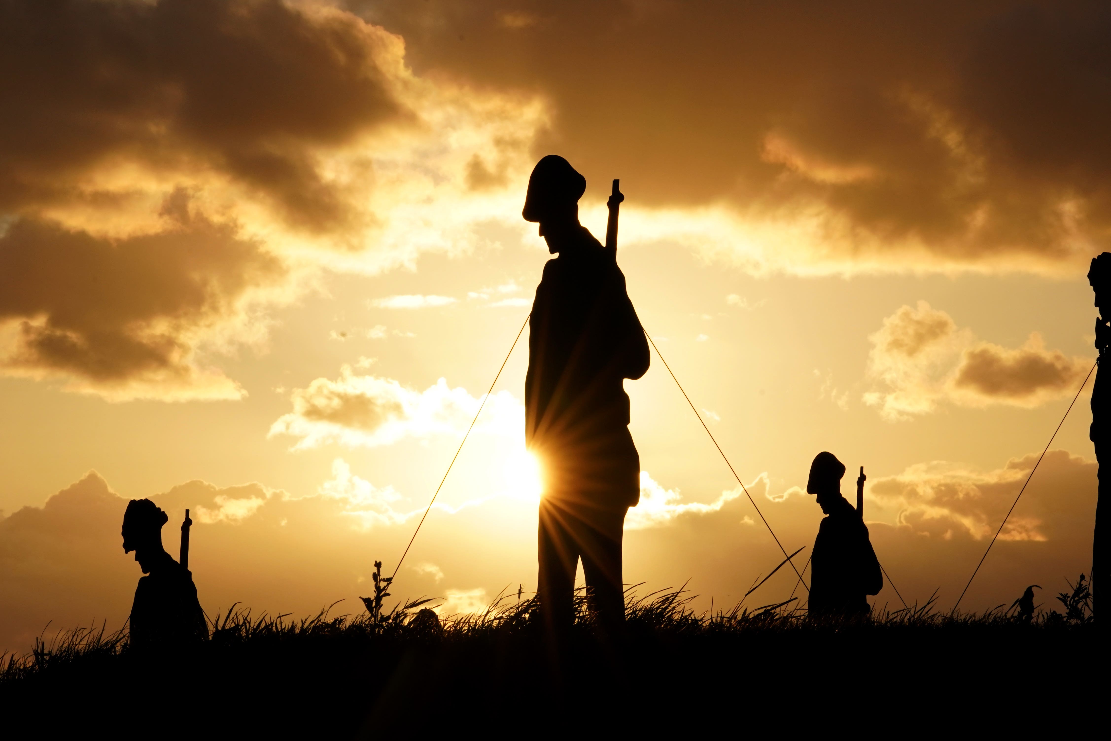 A view of the Standing with Giants silhouettes which create the For Your Tomorrow installation at the British Normandy Memorial, in Ver-Sur-Mer, France, as part of the 80th anniversary of D-Day (PA)