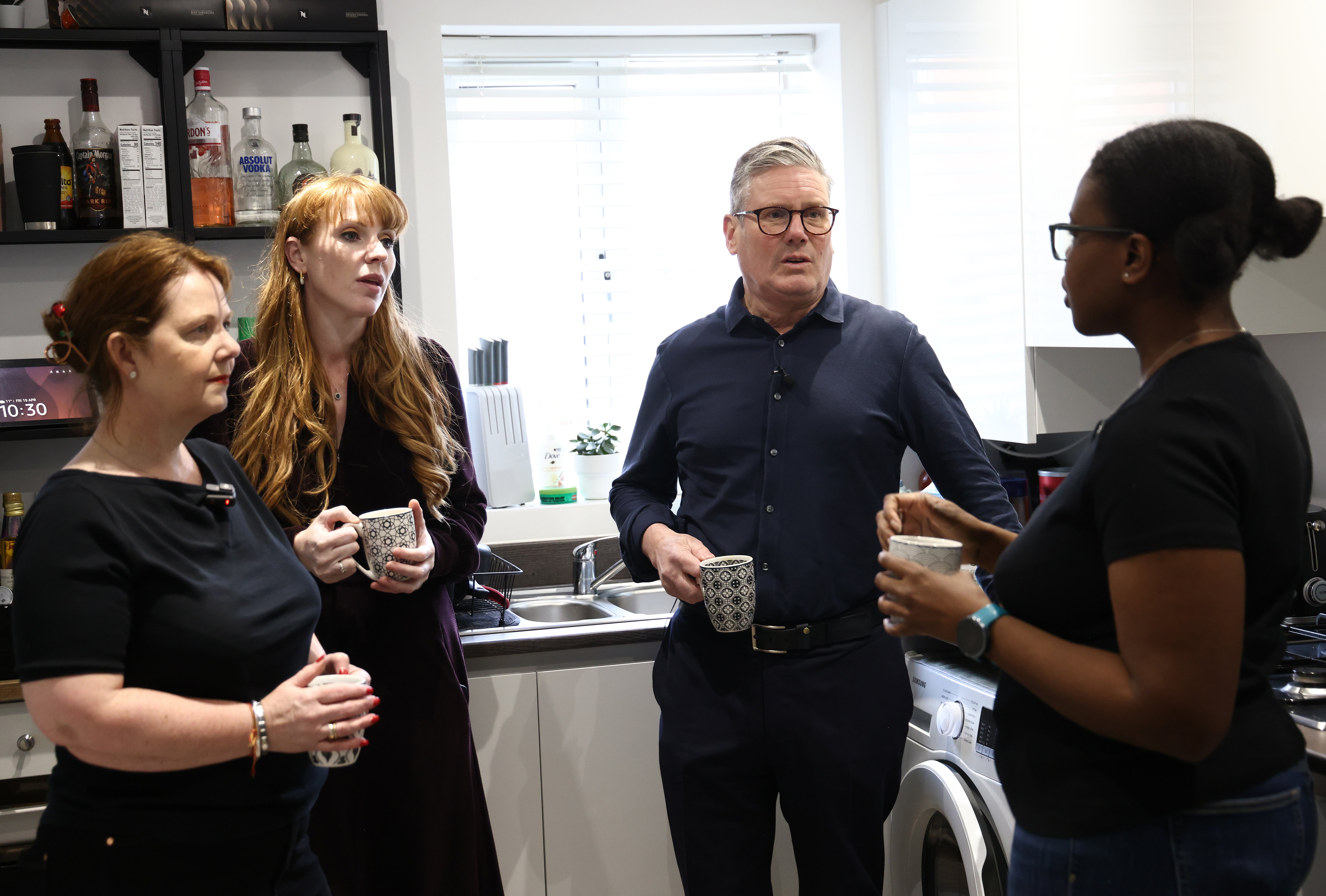 Labour Leader Keir Starmer (2nd R) and Deputy Leader Angela Rayner (2nd L) to speak to resident Gemma Smith (R) with East Midlands Mayor candidate Claire Ward during a visit to the Nightingale Quarter on April 19, 2024