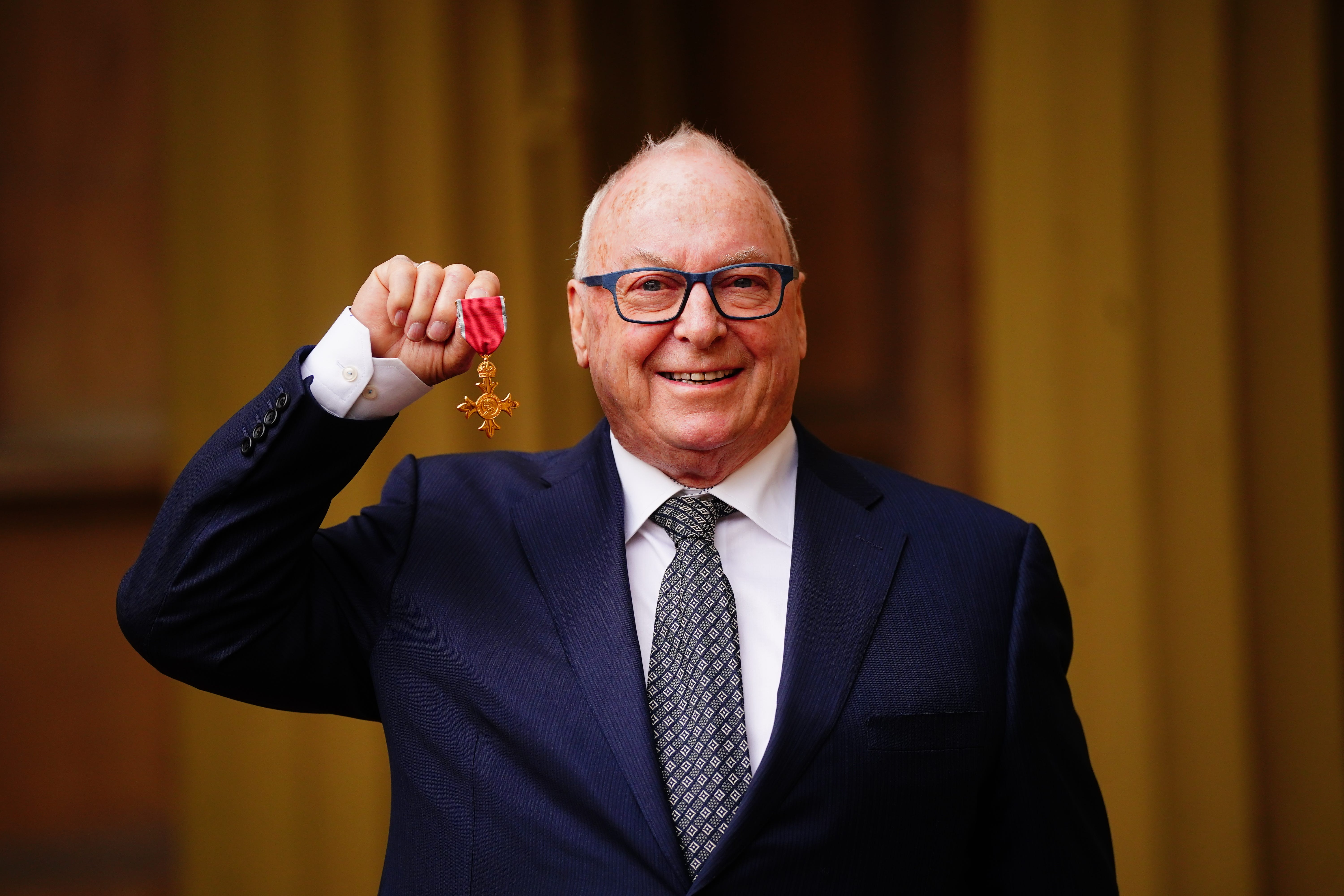 Philip Dudderidge after being made an Officer of the Order of the British Empire by the Princess Royal at Buckingham Palace (Victoria Jones/PA)