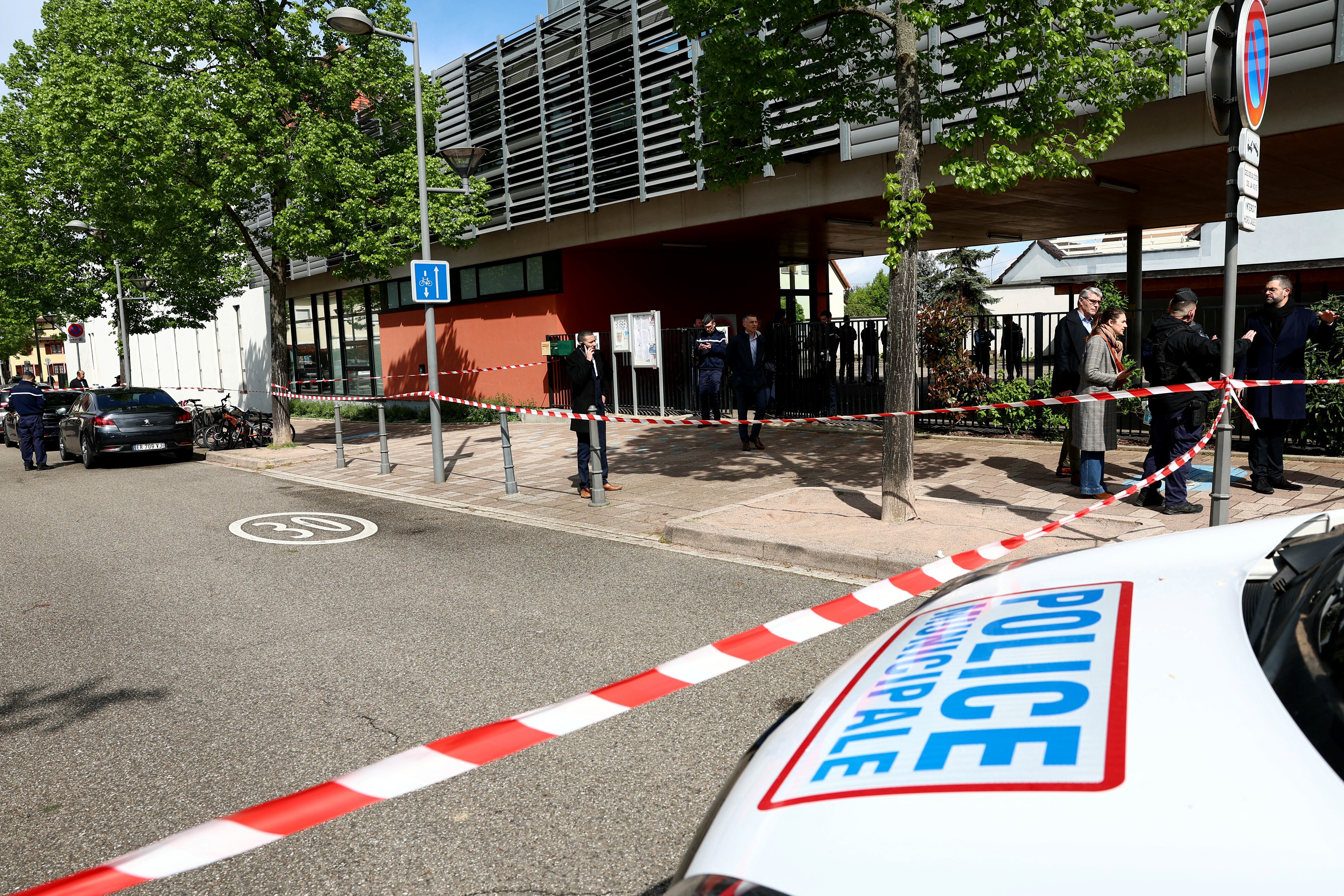 Police investigate around a school in the eastern France city of Souffelweyersheim after two girls were wounded in a knife attack outside the school on Thursday