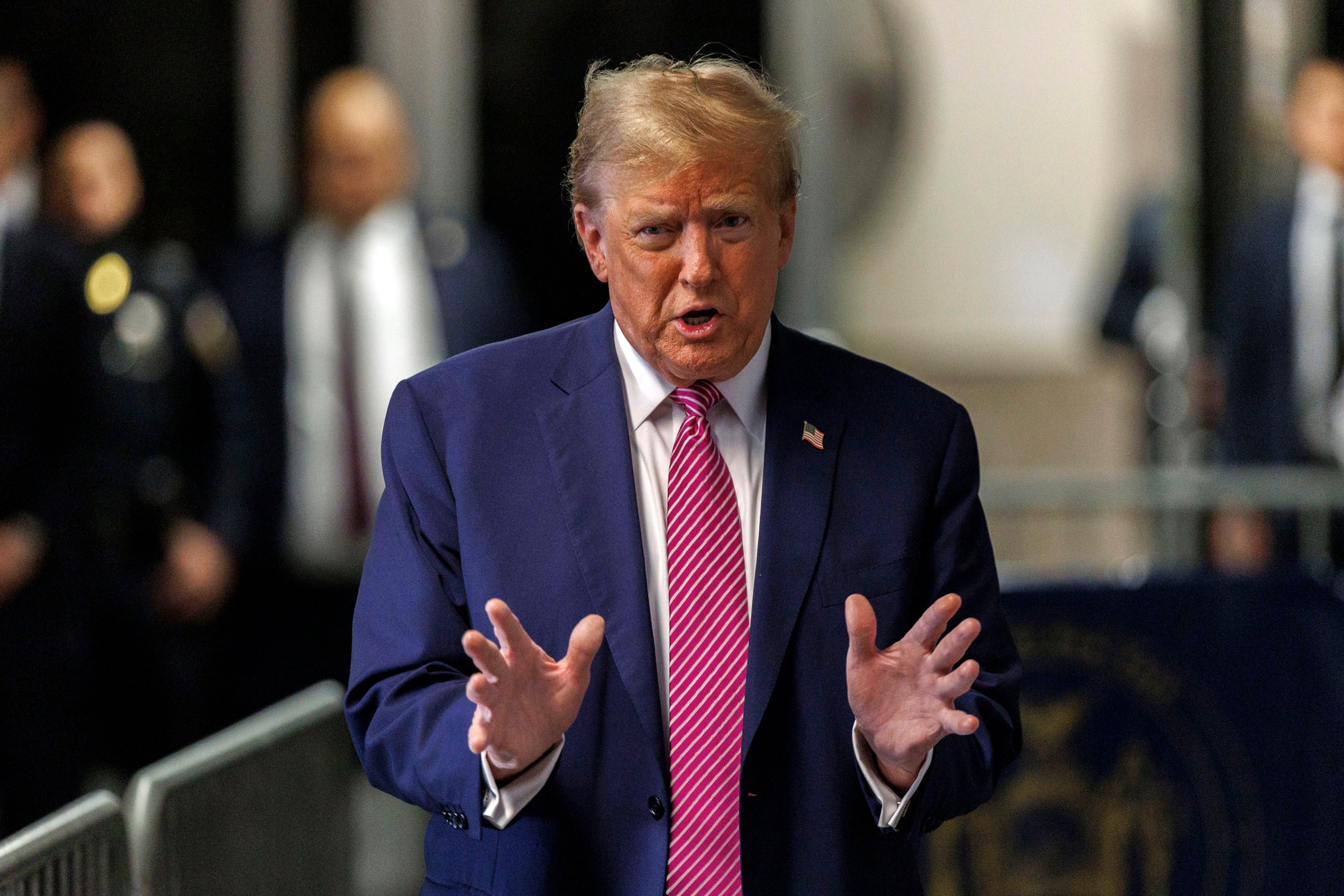 Former President Donald Trump speaks with the media at his trial on Friday at Manhattan Criminal Court