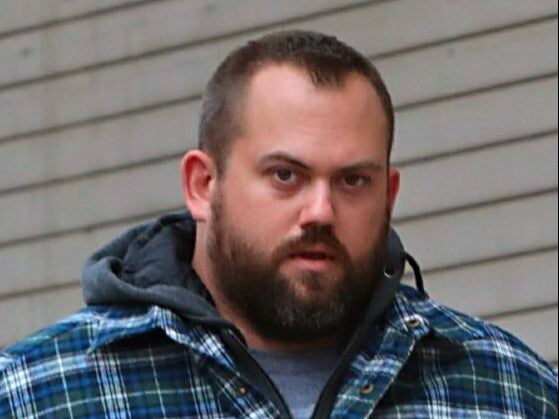 St Louis Police Officer Randy Hays exits the federal courthouse following his first court appearance, Nov. 30, 2018. Hays was sentenced to 52 months in prison and two years of probation