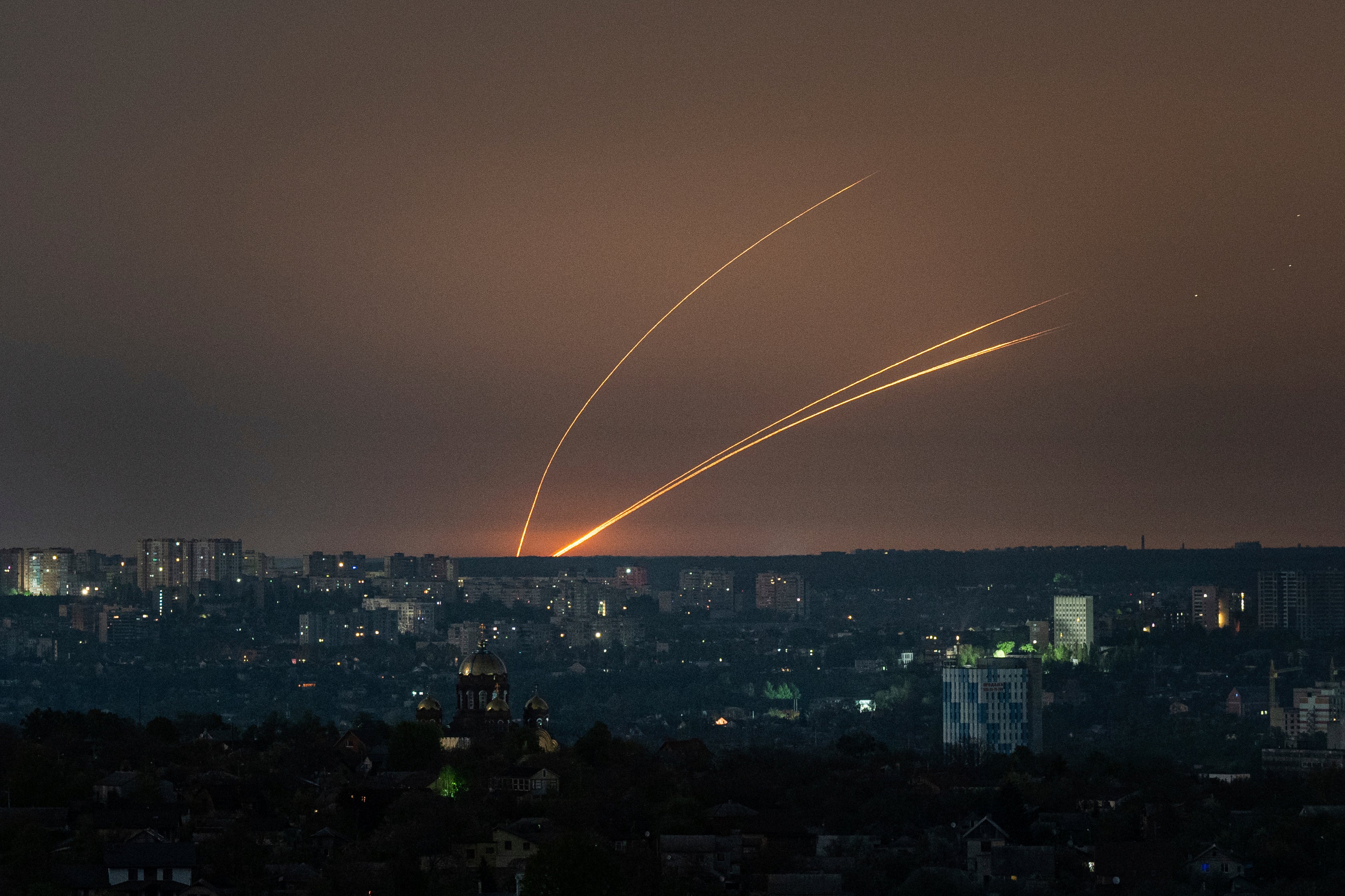 Russian rockets are launched against Ukraine from Russia’s Belgorod region, seen from Kharkiv, Ukraine, on Thursday