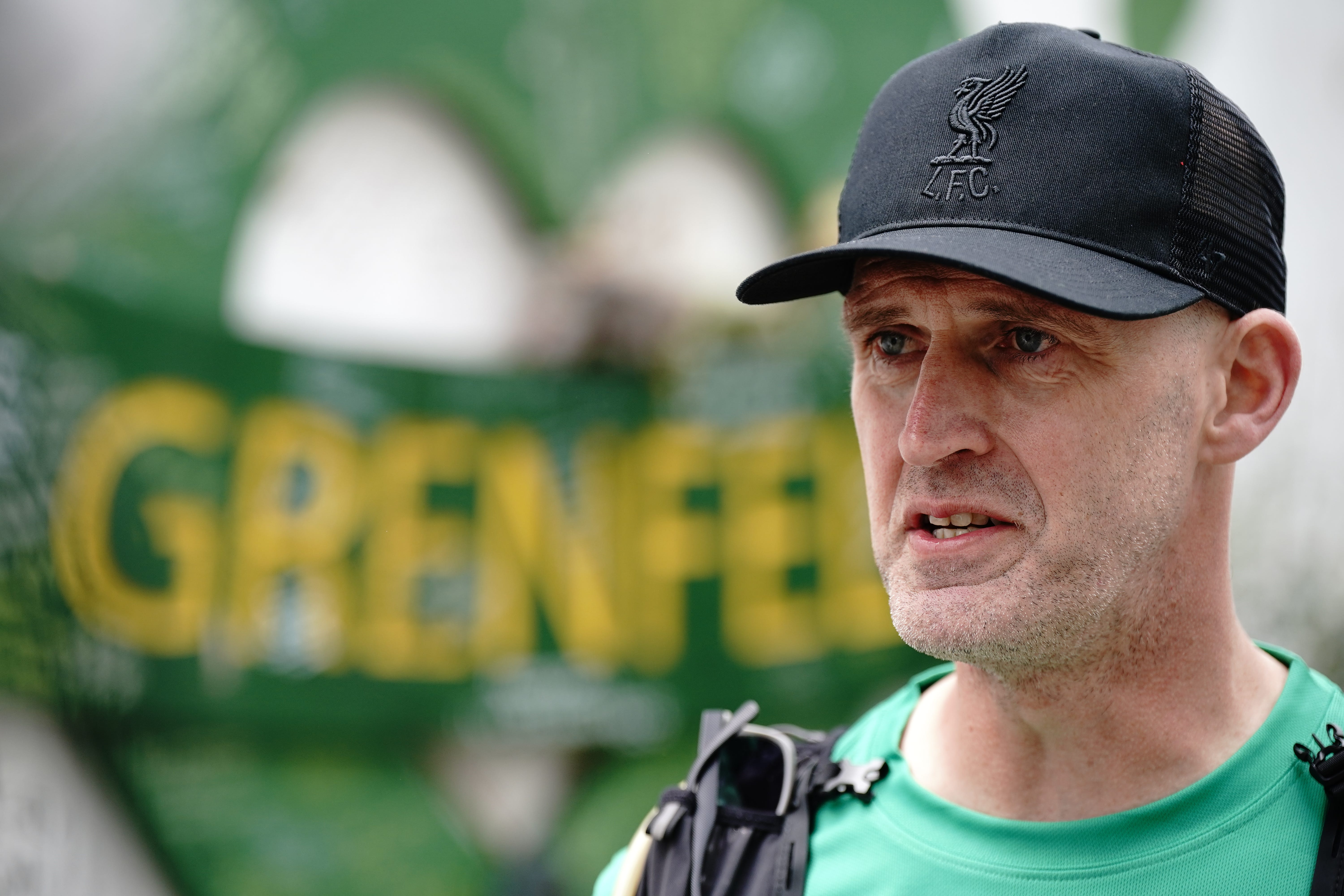 Mik Parkin, after finishing his charity run for the Hillsborough Law campaign, from Liverpool to London, at Grenfell Tower (Aaron Chown/PA)