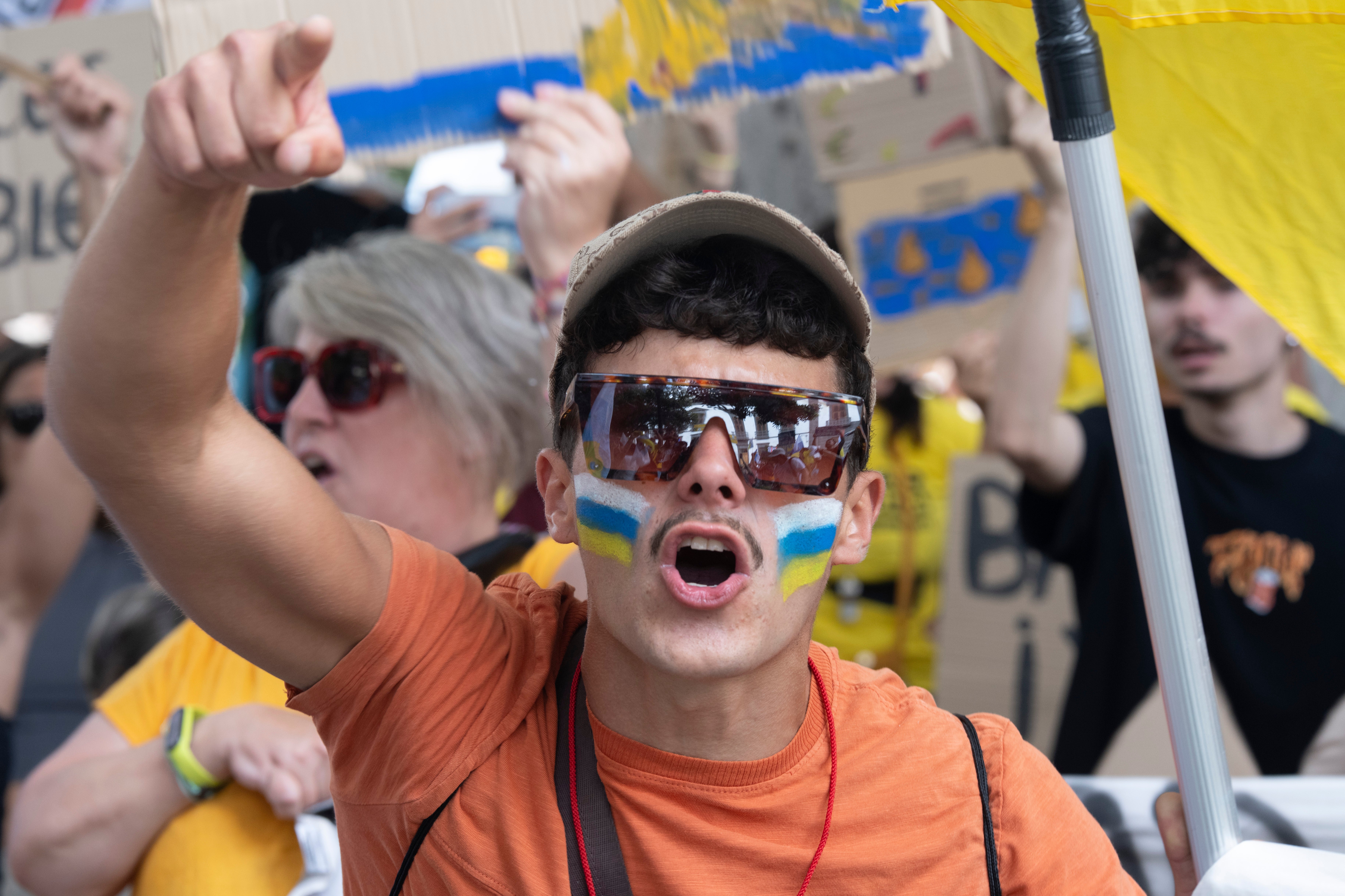 A man with the Canary Island flag painted on his face protests during a march against tourism in Santa Cruz de Tenerife, Spain, on Saturday