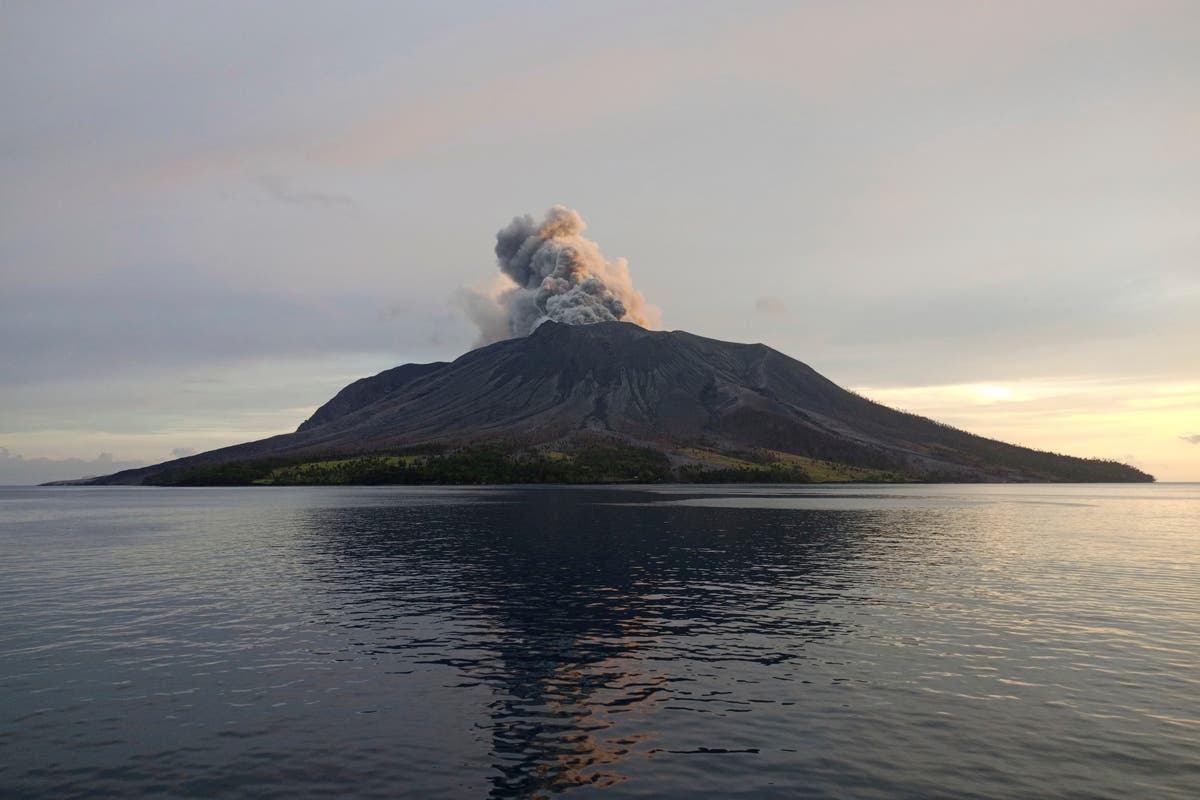 Airport near volcano reopens as Indonesia lowers eruption alert level