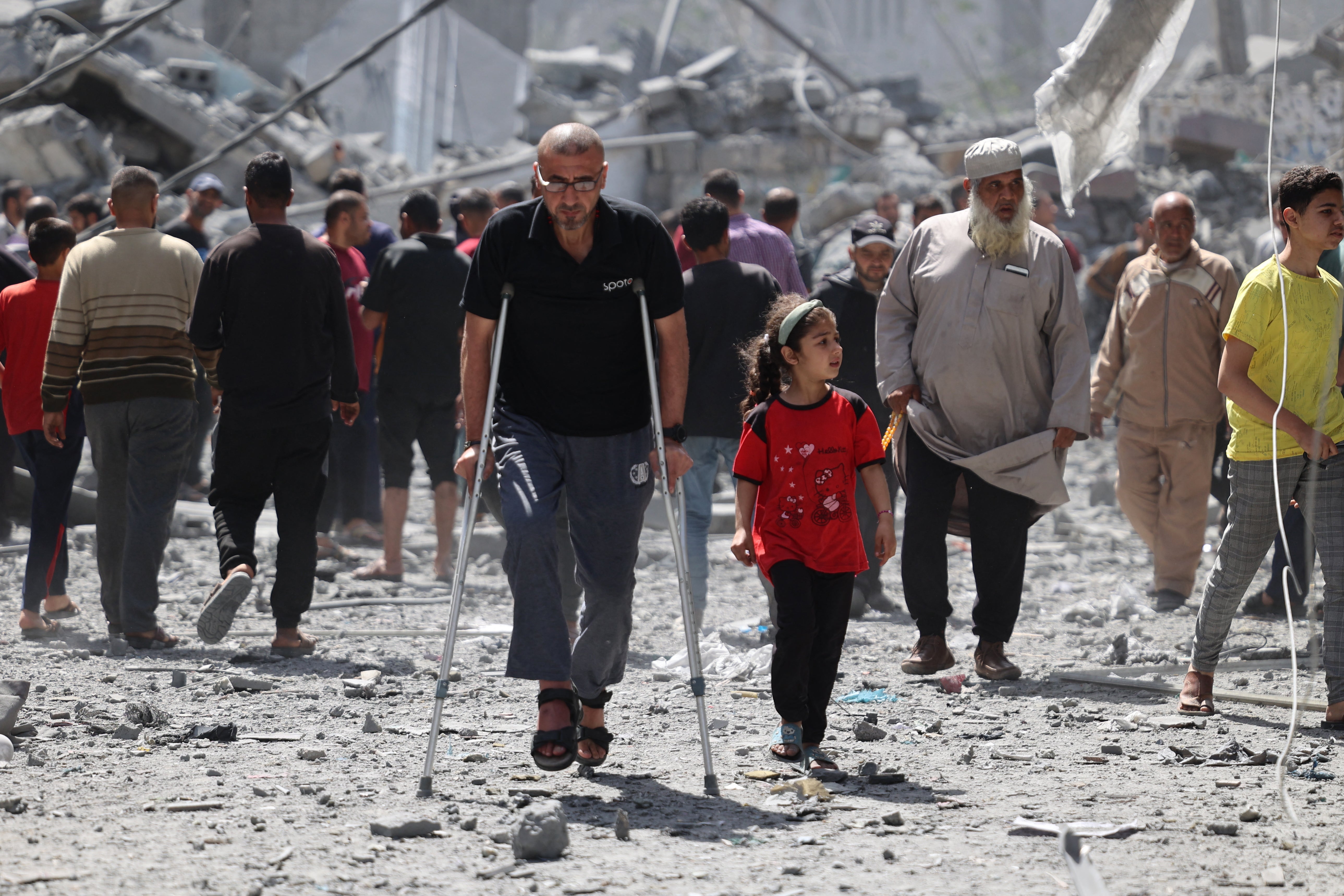 Palestinians inspect the debris after Israeli bombardment at Al-Daraj neighbourhood in Gaza City