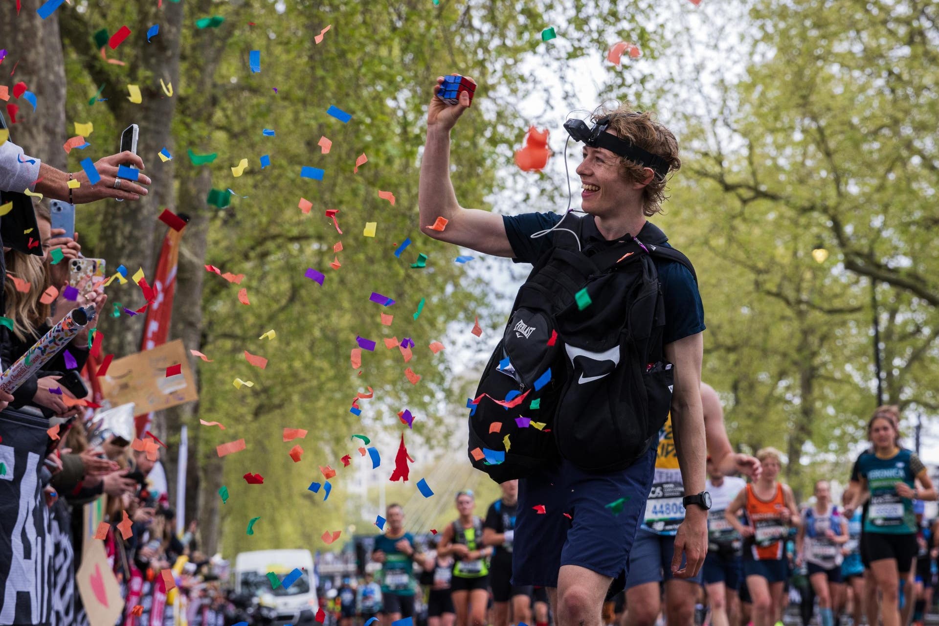 George Scholey has broken the world record for the most Rubik’s Cubes solved while running a marathon (Jonny Davies/Jike Media/PA)