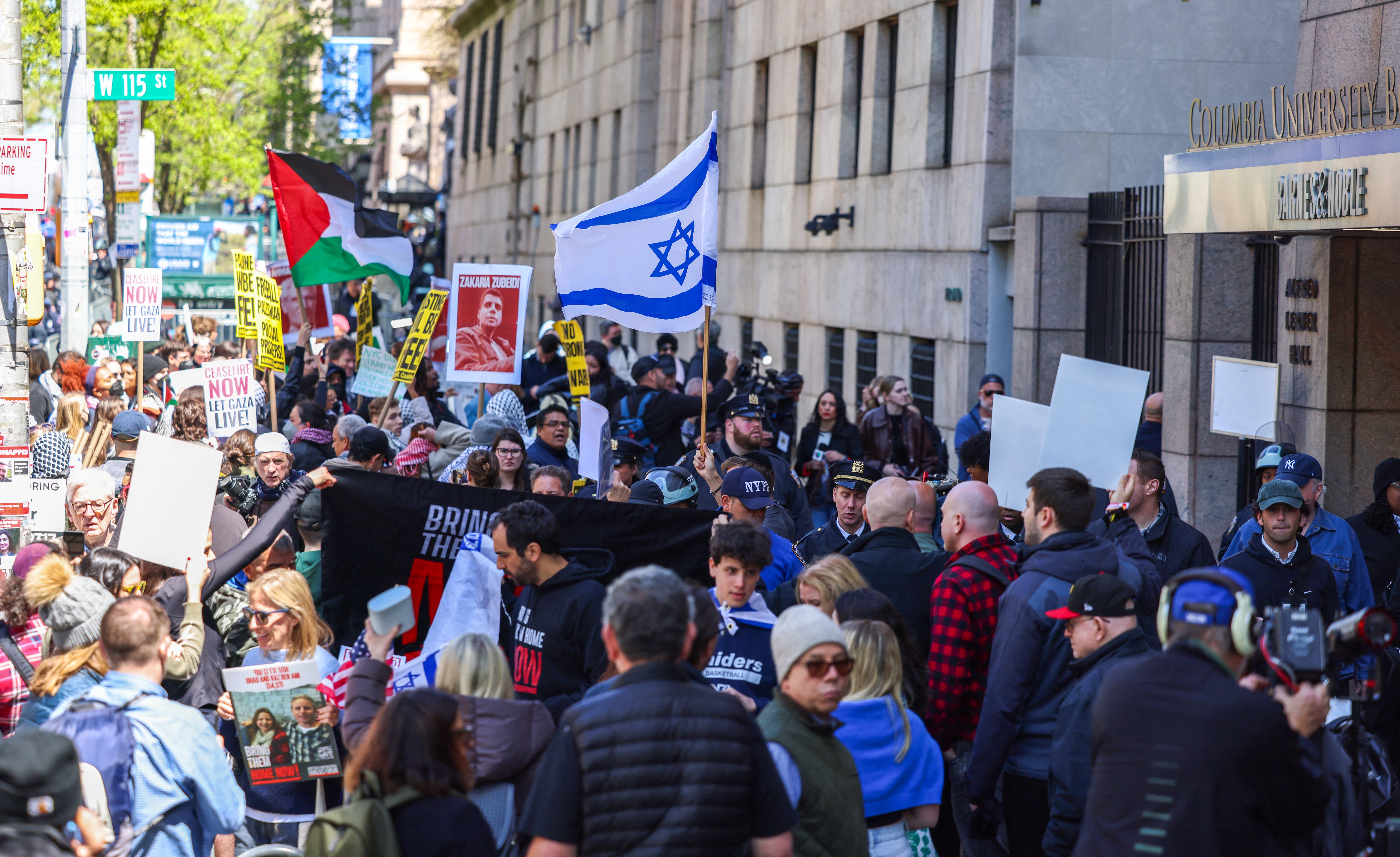 Pro-Palestine and pro-Israel demonstrators protest outside of Columbia University on Monday as tensions rise on the college campus in New York