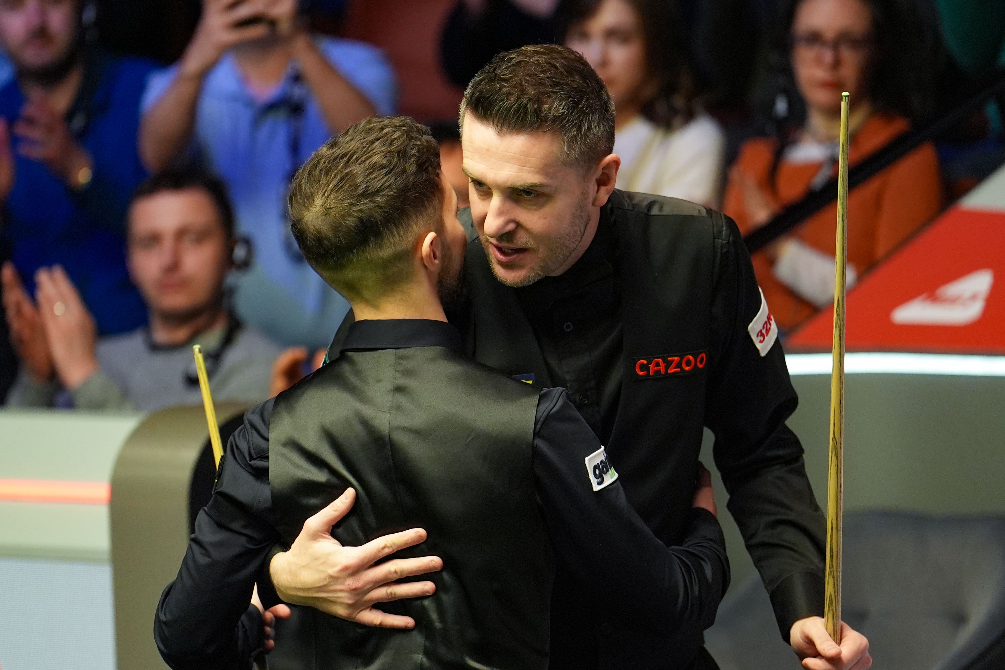 Joe O’Connor celebrates beating Mark Selby (right) on day three of the 2024 Cazoo World Snooker Championship at the Crucible Theatre, Sheffield. Picture date: Monday April 22, 2024.