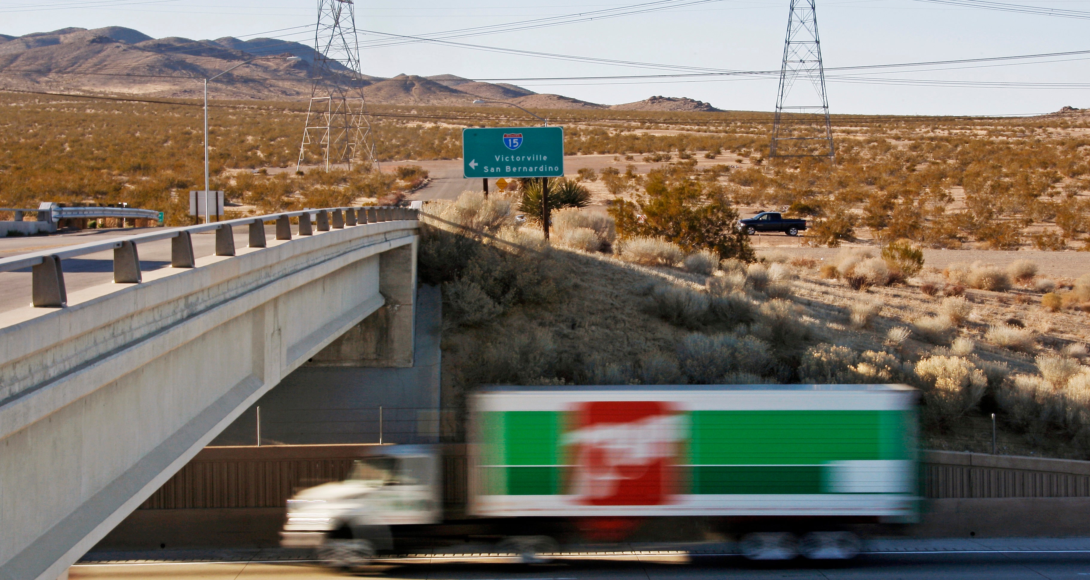 This photo taken Wednesday, Jan. 25, 2012, shows the site of a proposed station for a high-speed rail line to Las Vegas, background, at the end of the Dale Evans Parkway exit from Interstate 15