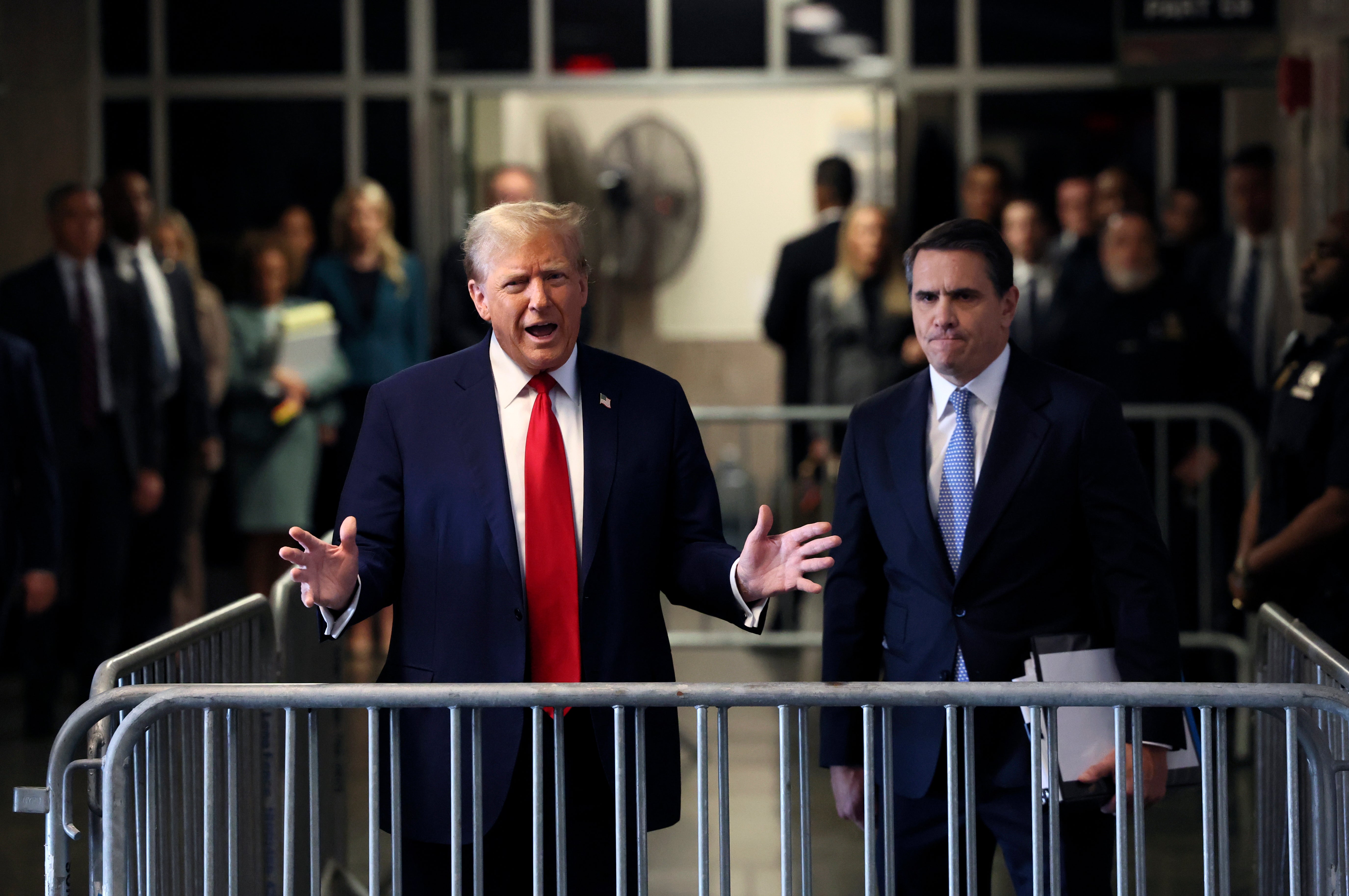 Former US President Donald Trump speaks to the media as he arrives at Manhattan criminal court for his hush money trial on 23 April 2024