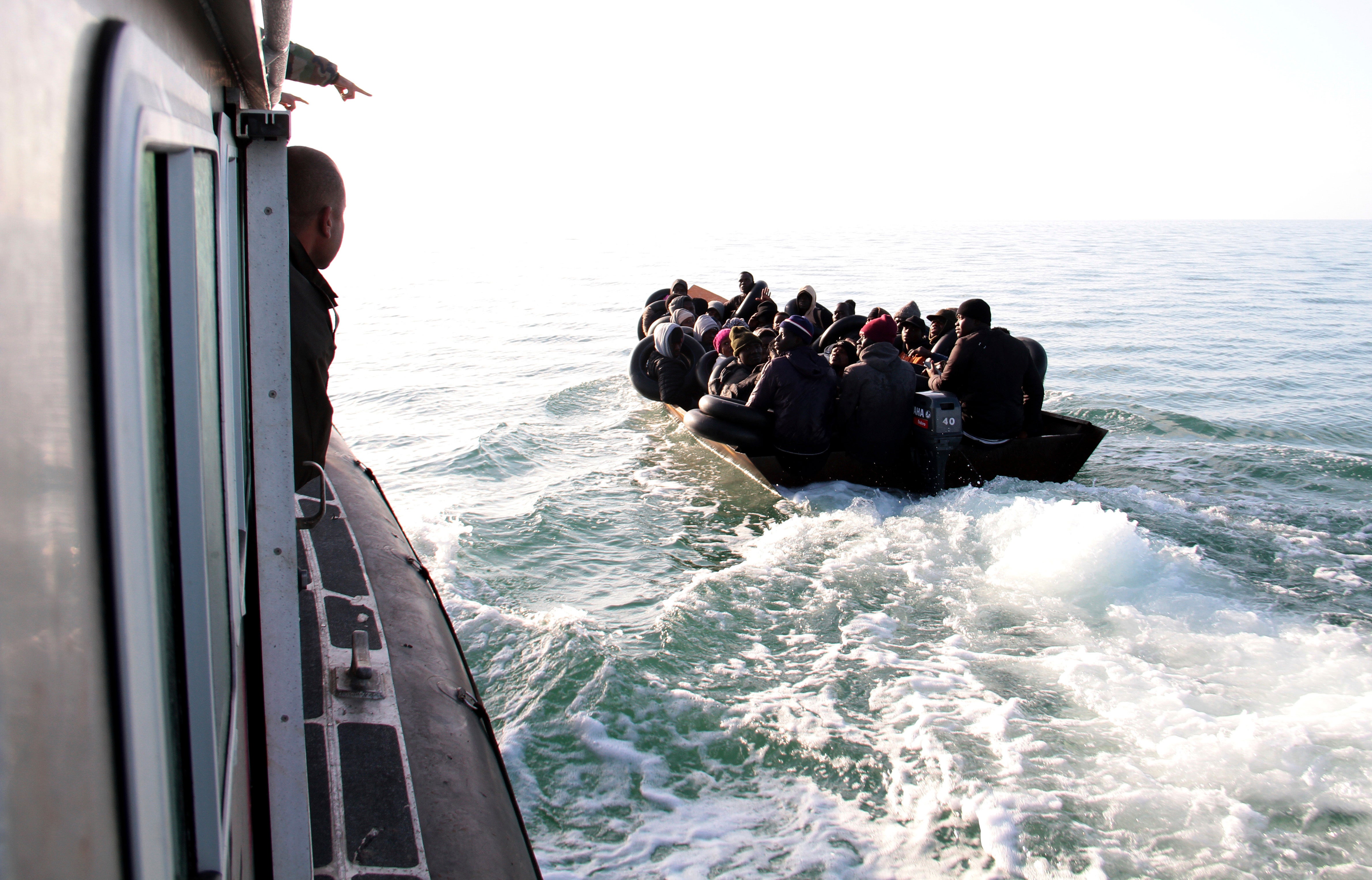 Migrants, mainly from sub-Saharan Africa, are stopped by Tunisian Maritime National Guard at sea during an attempt to get to Italy, near the coast of Sfax, Tunisia, Tuesday, April 18, 2023