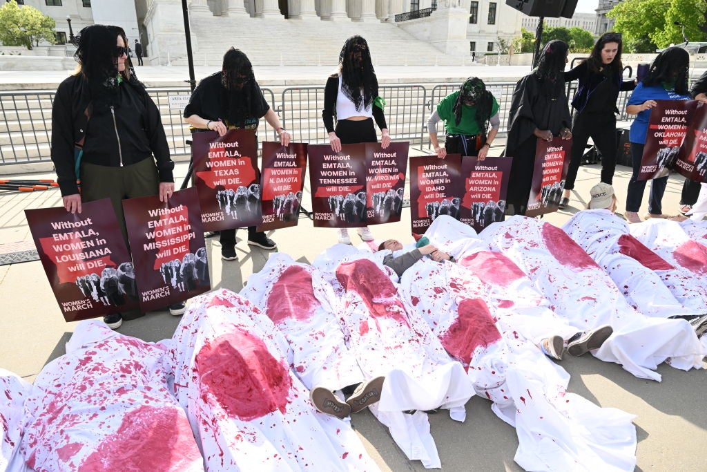 Protesters outside the Supreme Court as justices hear oral arguments over an Idaho law banning abortions in nearly all cases