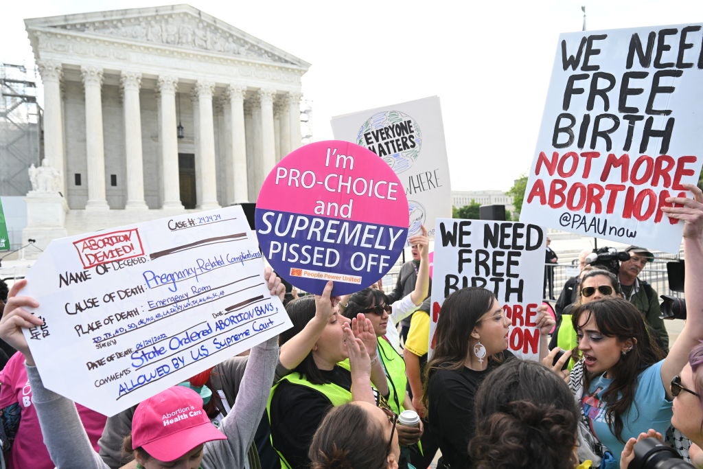 Reproductive rights activists outside of the Supreme Court at justices debate a near-total ban on abortion in Idaho