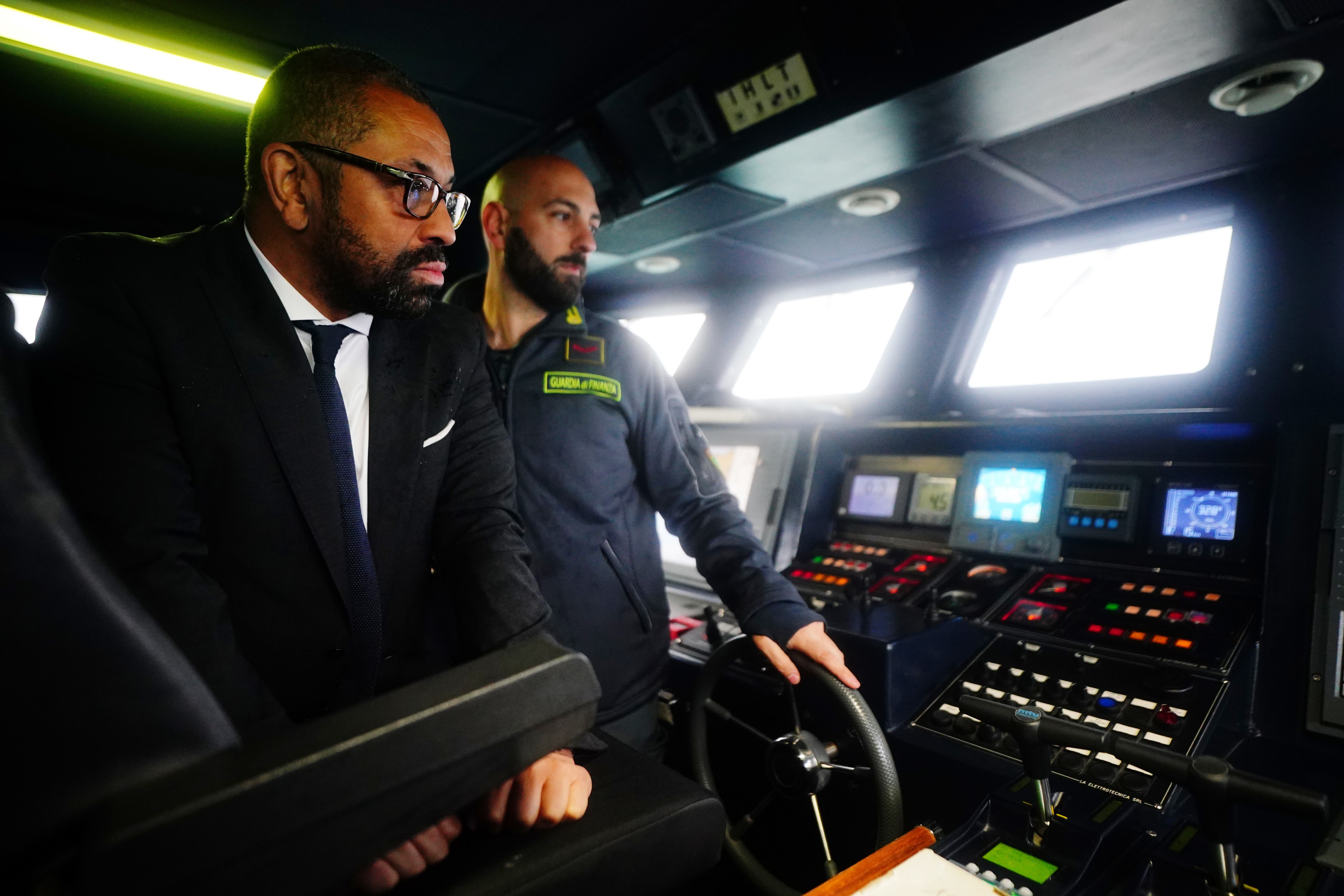 Home Secretary James Cleverly is shown a radar system during a tour of a police boat in Lampedusa Port (Victoria Jones/PA)